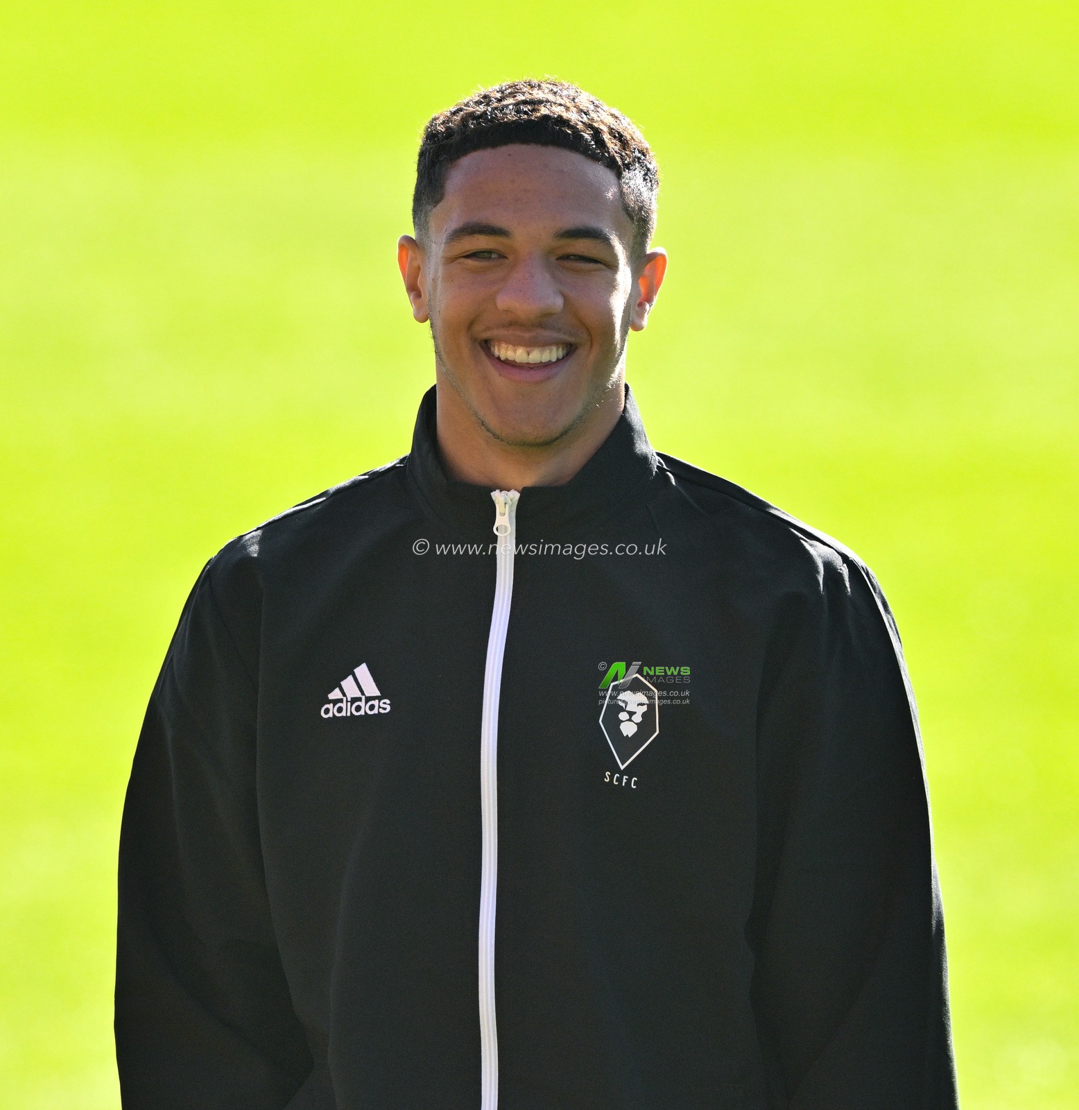 Ethan Ingram 2# of Salford City Football Club all smiles as he inspects the pitch ahead of the match, during the Sky Bet League 2 match Wrexham vs Salford City at SToK Cae Ras, Wrexham, United Kingdom, 14th October 2023

(Photo by Cody Froggatt/News Images)