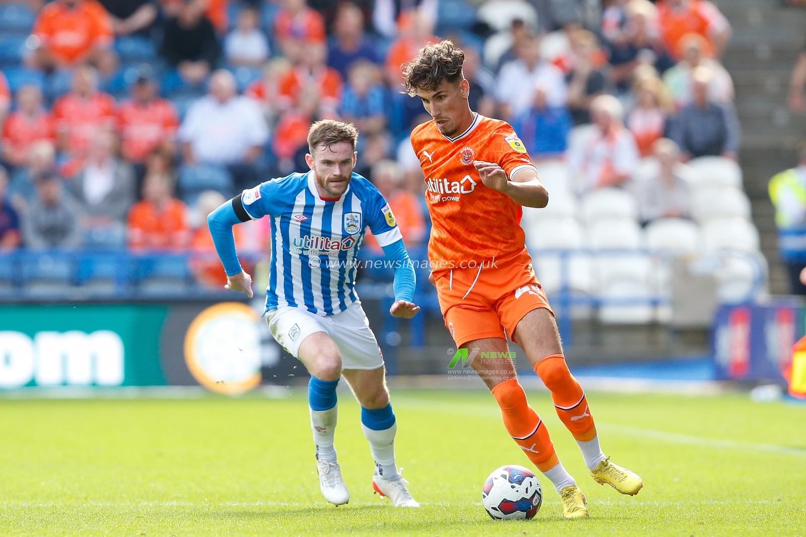 Oliver Turton #2 of Huddersfield Town and Theo Corbeanu #25 of Blackpool during the Sky Bet Championship match Huddersfield Town vs Blackpool at John Smith's Stadium, Huddersfield, United Kingdom, 4th September 2022

(Photo by Ben Early/News Images)