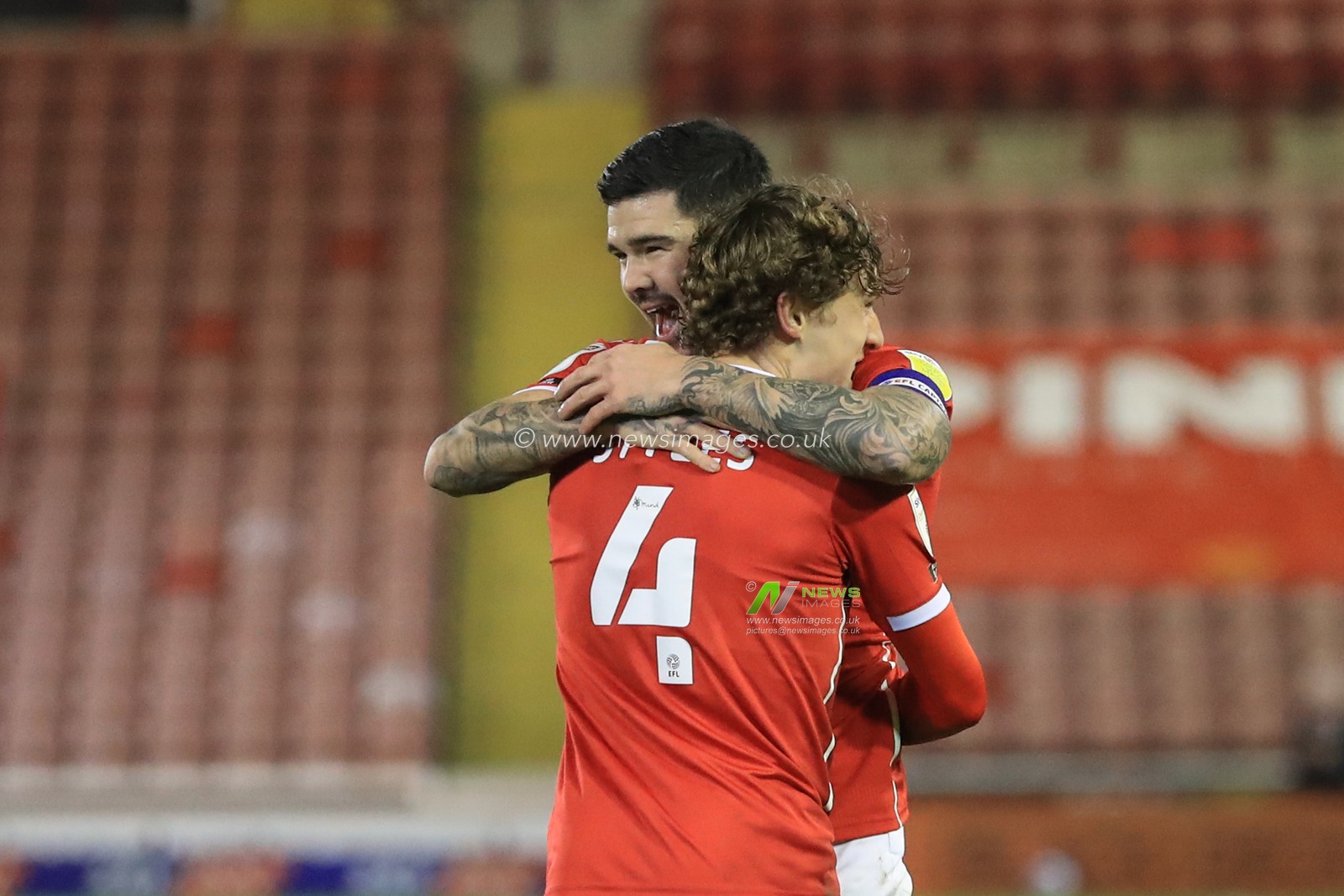 Alex Mowatt #27 of Barnsley celebrates his goal to make it 1-1 with Callum Styles #4 of Barnsley