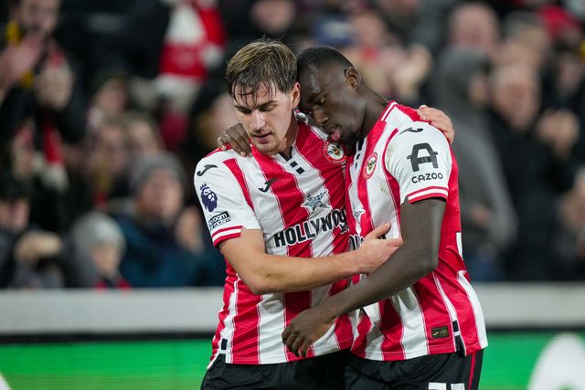 Michael Kayode of Brentford hugs Yehor Yarmolyuk of Brentford who has just been substituted during the Premier League match Brentford vs Bournemouth at The Gtech Community Stadium, London, United Kingdom, 27th December 2025

(Photo by Maynard Manyowa/News Images)

*** GER AUT SUI OUT ***