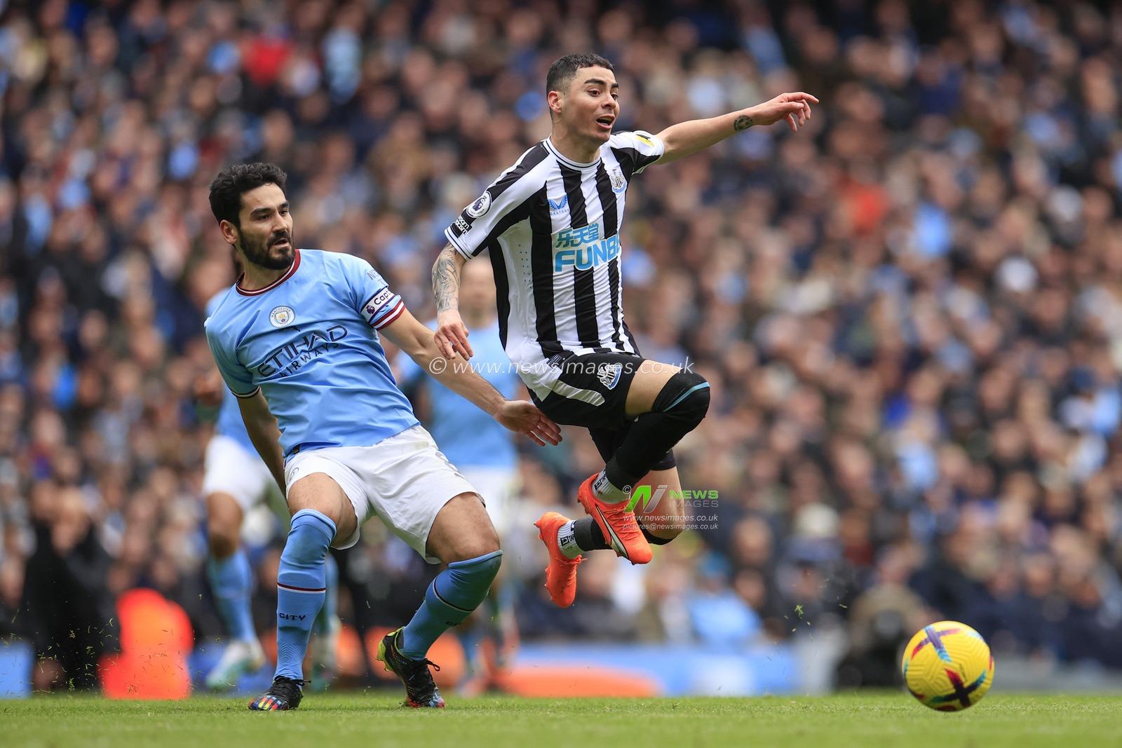 Miguel Almiron #24 of Newcastle United rides a tackle by Ilkay Gundogan #8 of Manchester City during the Premier League match Manchester City vs Newcastle United at Etihad Stadium, Manchester, United Kingdom, 4th March 2023

(Photo by Conor Molloy/News Images)