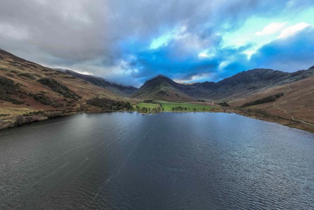 ***EDITORS NOTE THIS IS A PANO PHOTO MADE FROM MULTIPLE SHOTS FROM THE DRONE AND FINISHED IN CAMERA***

An Aerial view of Buttermere and the surrounding mountains during a cold winters morning at Buttermere, TheLake District, Cumbria, United Kingdom, 3rd January 2025

(Photo by Mark Cosgrove/News Images)