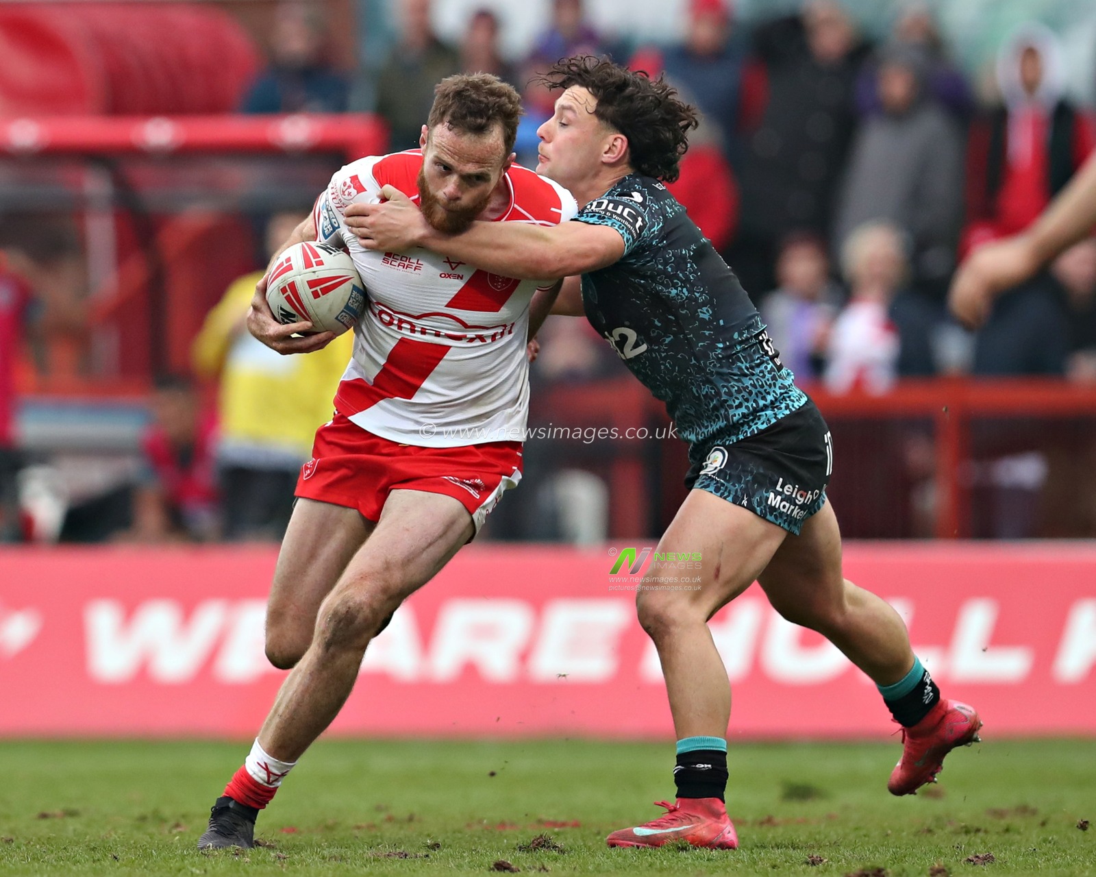 Lachlan Lam of Leigh Leopards tackles Joe Burgess of Hull KR during the Betfred Super League Round 5 match Hull KR vs Leigh Leopards at Sewell Group Craven Park, Kingston upon Hull, United Kingdom, 22nd March 2025

(Photo by Sam Eaden/News Images)