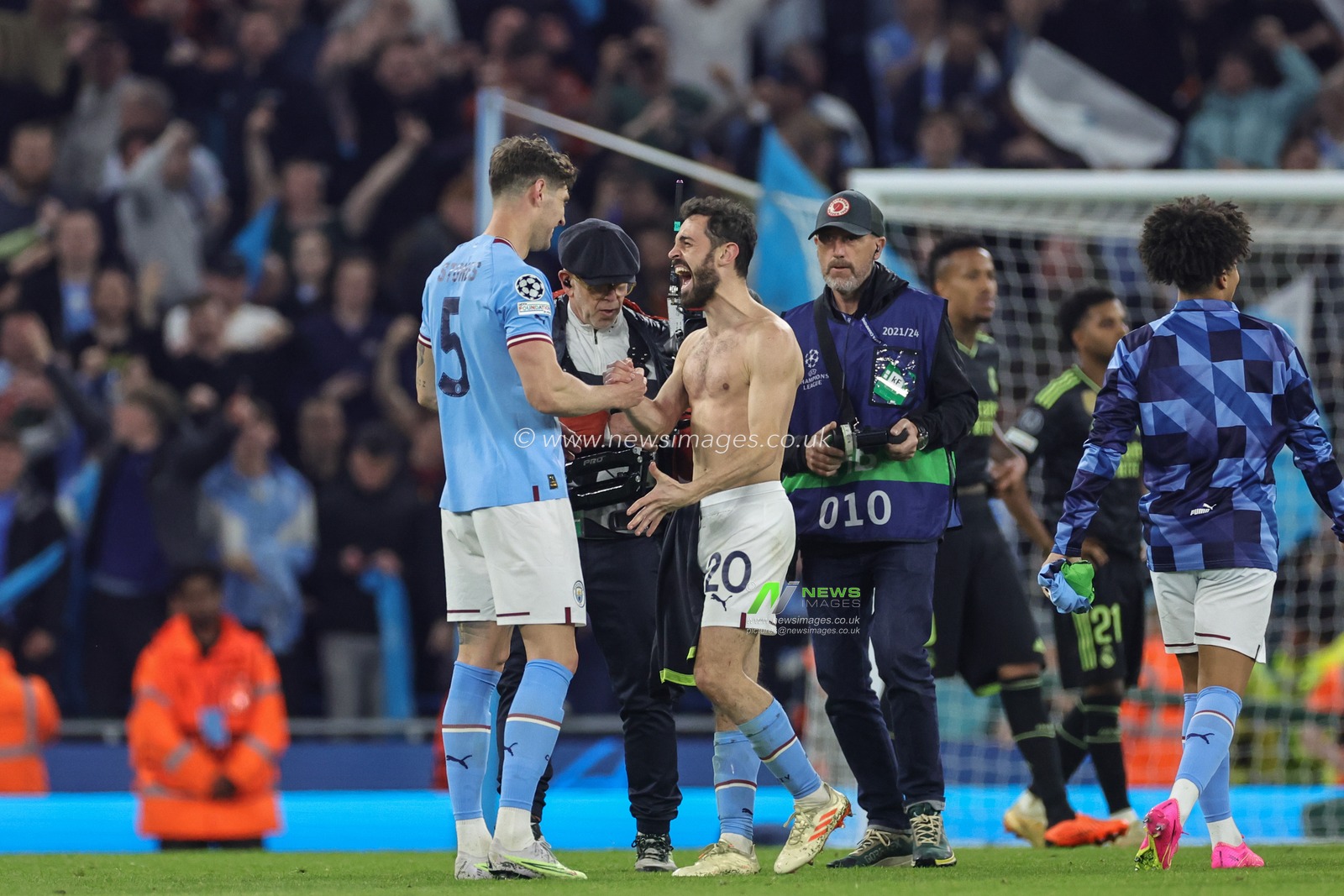 John Stones #5 of Manchester City and Bernardo Silva #20 of Manchester City celebrate their teams win after the UEFA Champions League Semi-Final Second Leg Manchester City vs Real Madrid at Etihad Stadium, Manchester, United Kingdom, 17th May 2023

(Photo by Mark Cosgrove/News Images)