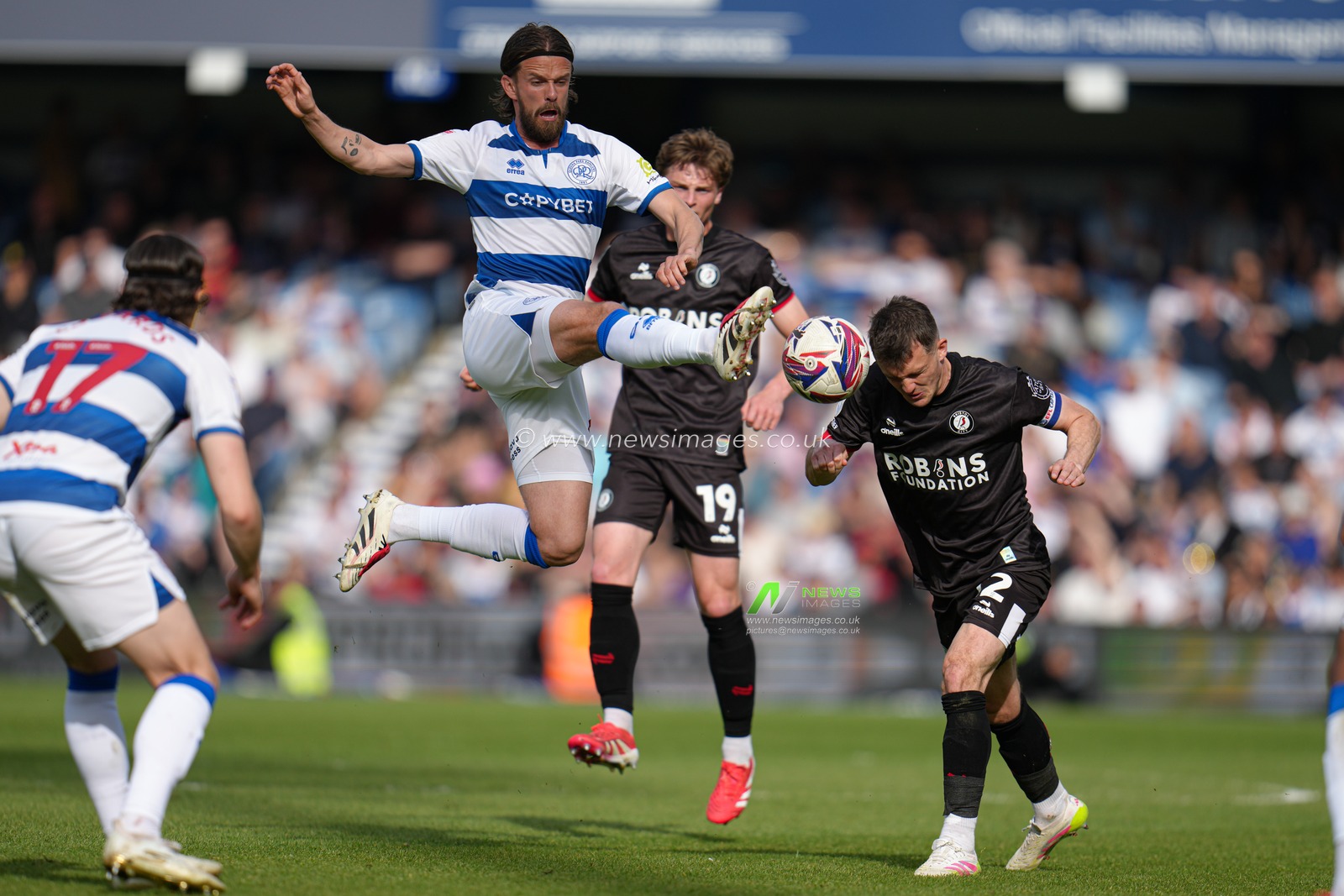 Ronnie Edwards of Queens Park Rangers makes a high challenge during the Sky Bet Championship match Queens Park Rangers vs Bristol City at Kiyan Prince Foundation Stadium, London, United Kingdom, 12th April 2025

(Photo by Harvey Murphy/News Images)