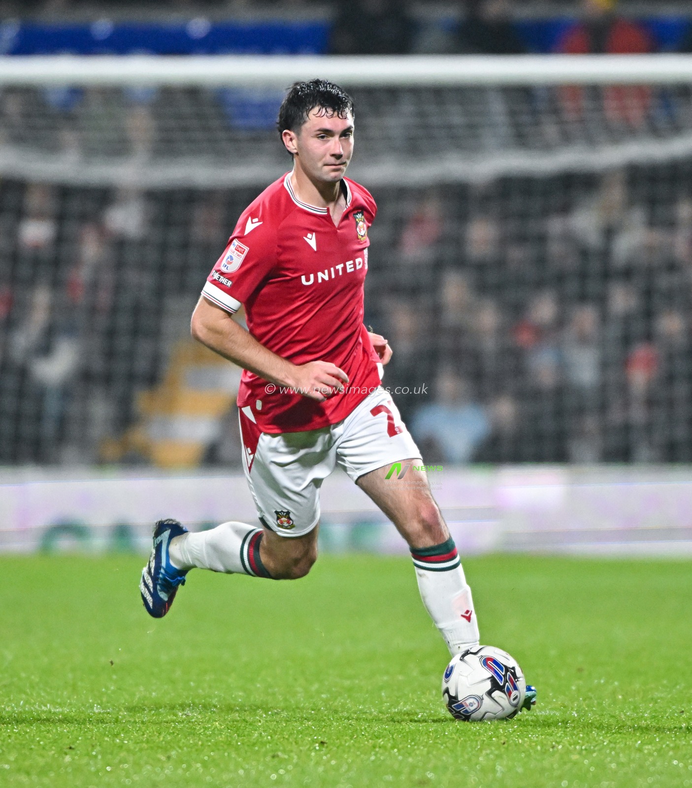 Thomas O'Connor 22# of Wrexham Association Football Club on the ball, during the Sky Bet League 2 match Wrexham vs Sutton United at SToK Cae Ras, Wrexham, United Kingdom, 24th October 2023

(Photo by Cody Froggatt/News Images)
