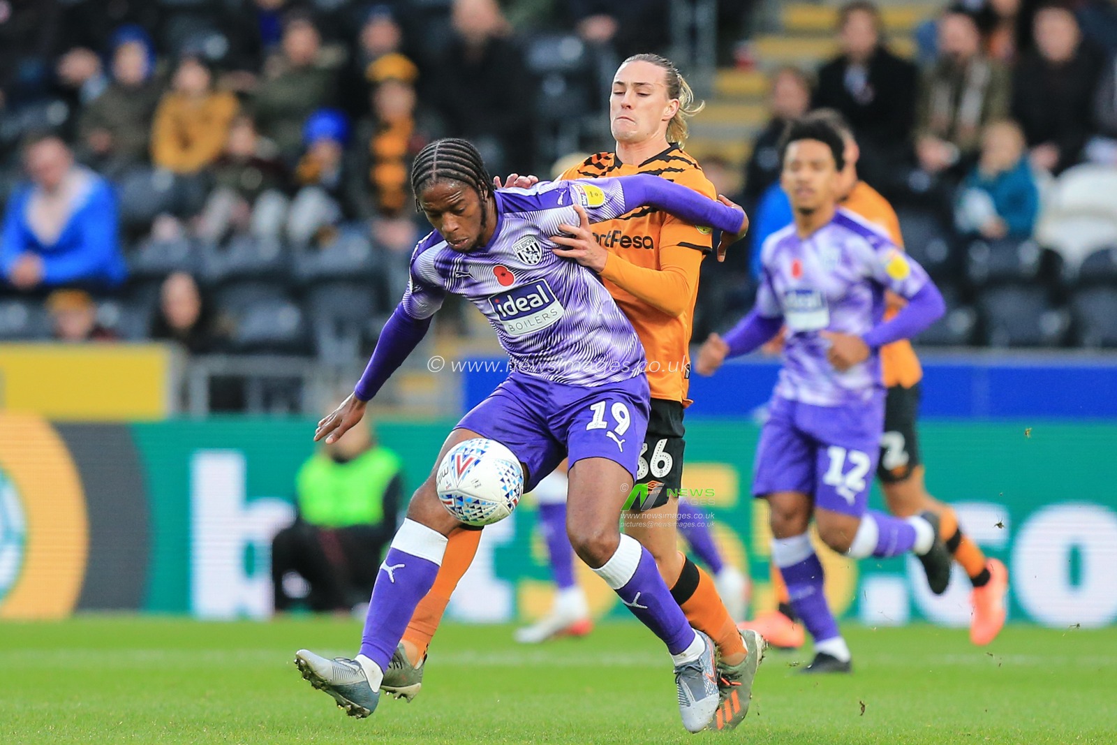 9th November 2019, KC Stadium, Kingston upon Hull, England; Sky Bet Championship, Hull City v West Bromwich Albion : Romain Sawyers (19) of West Bromwich Albion and Jackson Irvine (36) 0f Hull City challenge for the ball

Credit: David Greaves/News Images