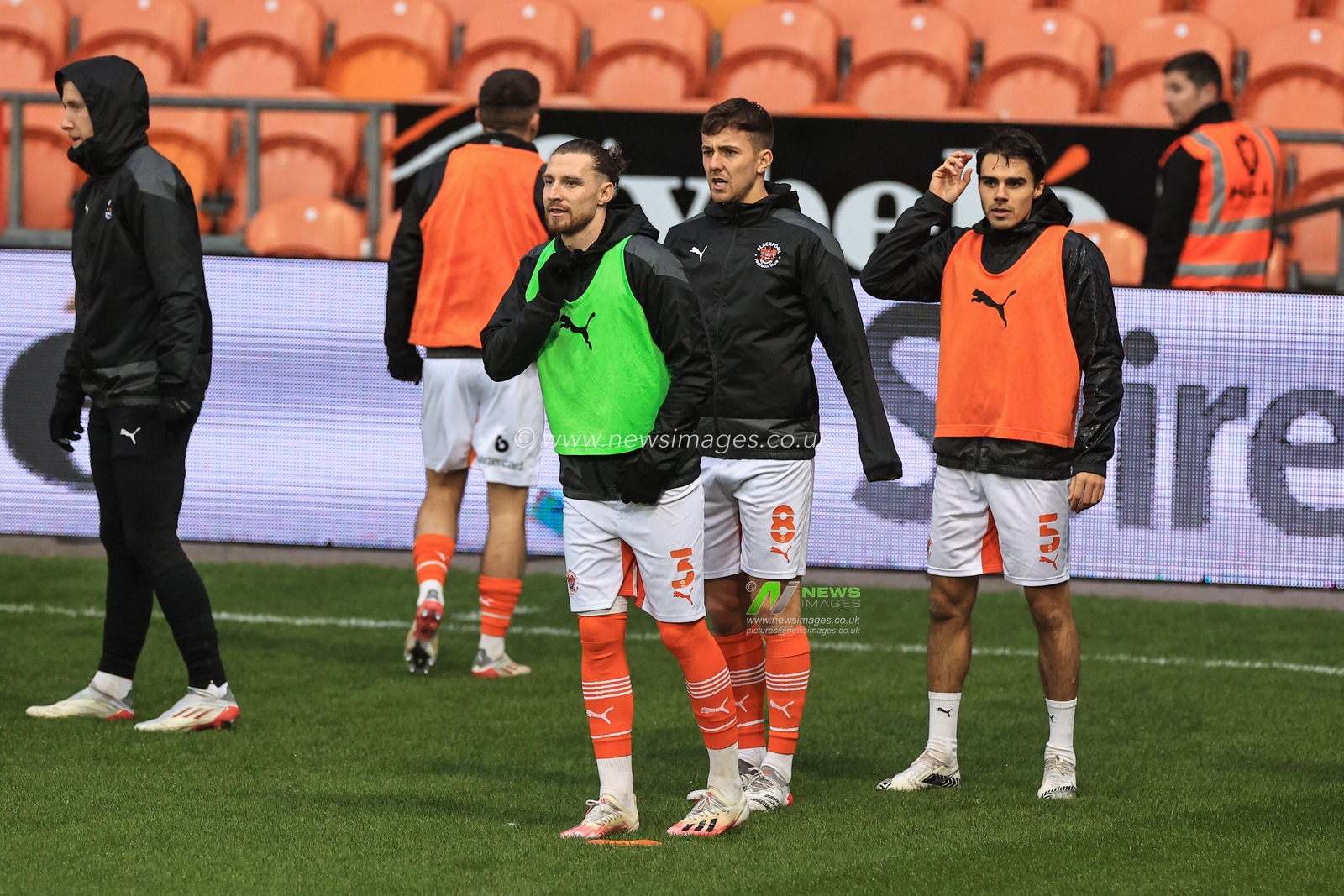 James Husband #3 of Blackpool, Ryan Wintle #8 of Blackpool and Reece James #5 of Blackpool  during the pre-game warmup