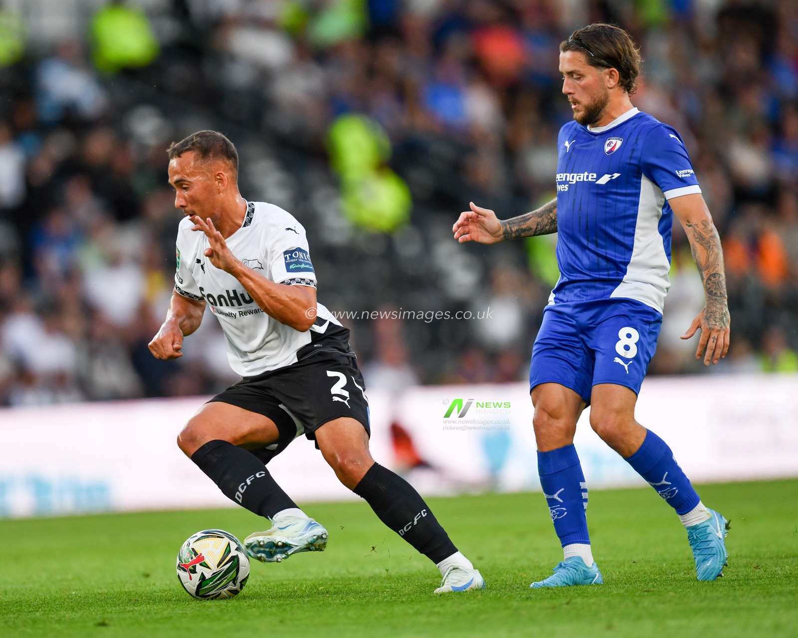 Kane WILSON of Derby County FC and Darren OLDAKER of Chesterfield FC dual for the ball during the Carabao Cup match Derby County vs Chesterfield at Pride Park Stadium, Derby, United Kingdom, 13th August 2024

(Photo by Mark Dunn/News Images)