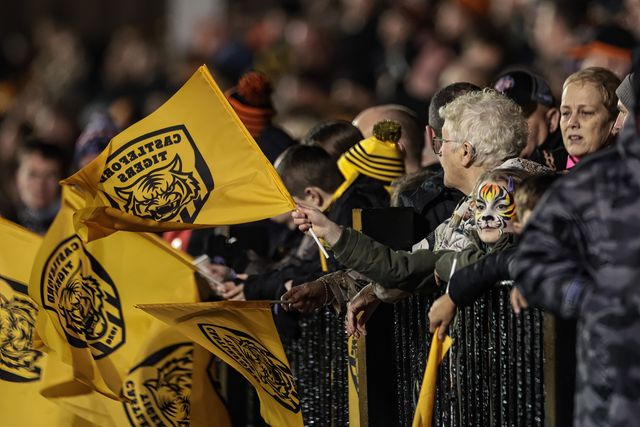 A young Castleford fan with a tiger face paint waves a flag during the Betfred Super League Round 3 match Castleford Tigers vs Huddersfield Giants at OneBore Stadium, Castleford, Untied Kingdom on 27 February 2026

(Photo by Mark Cosgrove/News Images)