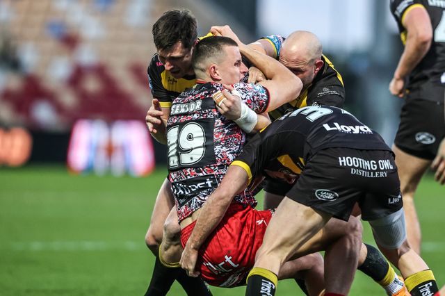 Innes Senior of Leigh Leopards is tackled by Sam Wood of York Knights and Paul McShane of York Knights during the Betfred Super League round 8 match York Knights vs Leigh Leopards at LNER Community Stadium, York, United Kingdom on 17 April 2026

(Photo by Alfie Cosgrove/News Images)