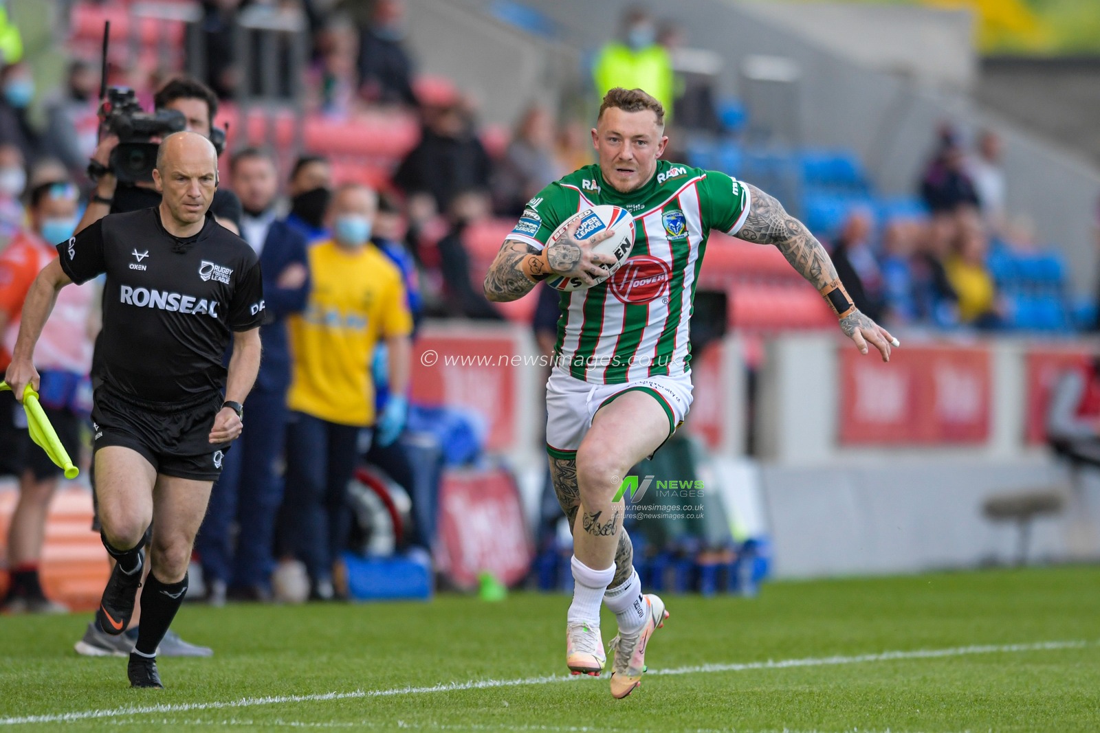 Josh Charnley (5) of Warrington Wolves runs with the ball