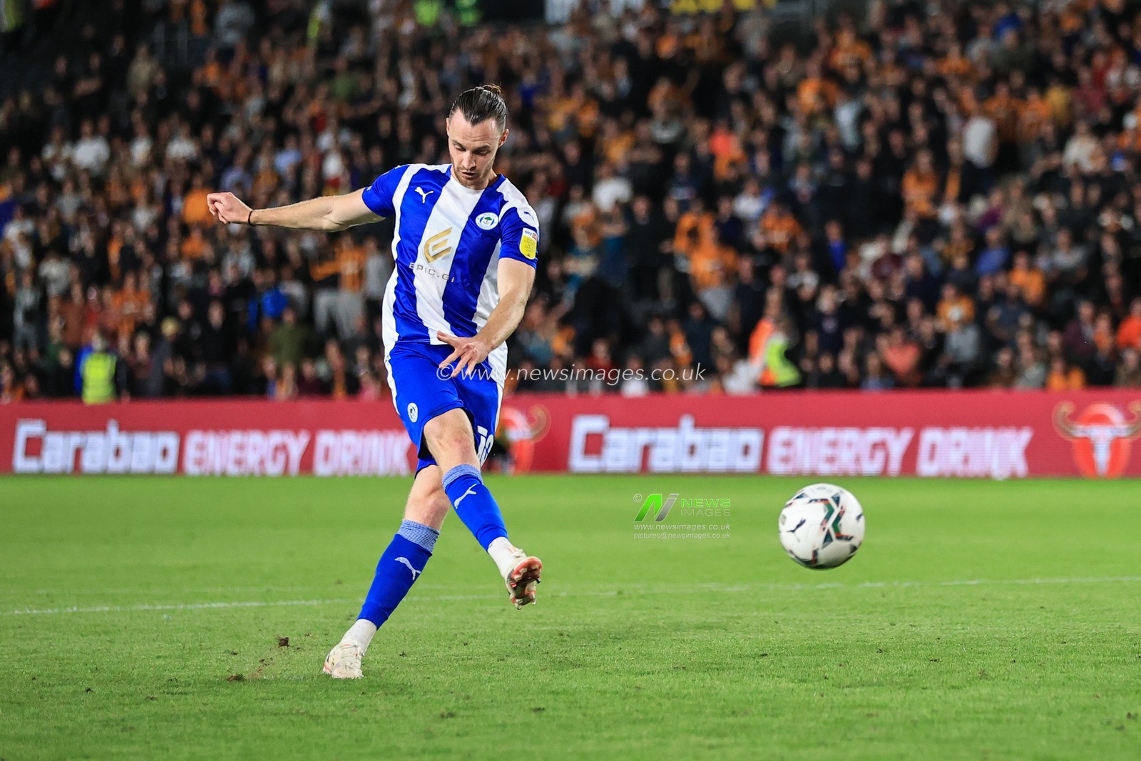 Will Keane #10 of Wigan Athletic scores his penalty