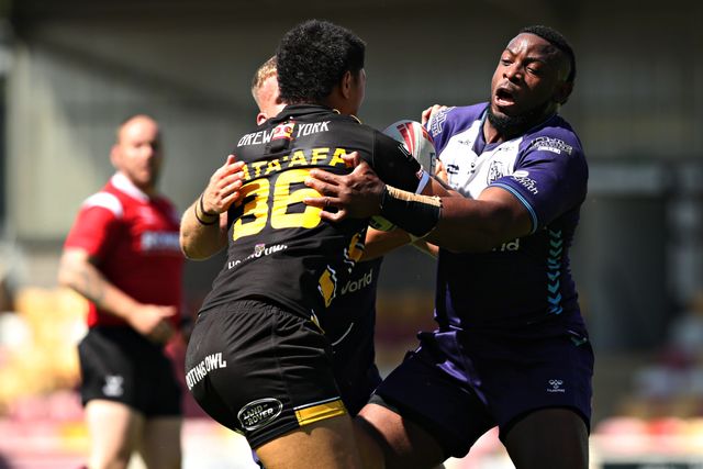 Gadwin Springer of Featherstone Rovers tackles Toa Mata'Afa of York Knights RLFC during the Betfred Championship match York City Knights vs Featherstone Rovers at LNER Community Stadium, York, United Kingdom, 29th June 2025

(Photo by Sam Eaden/News Images)