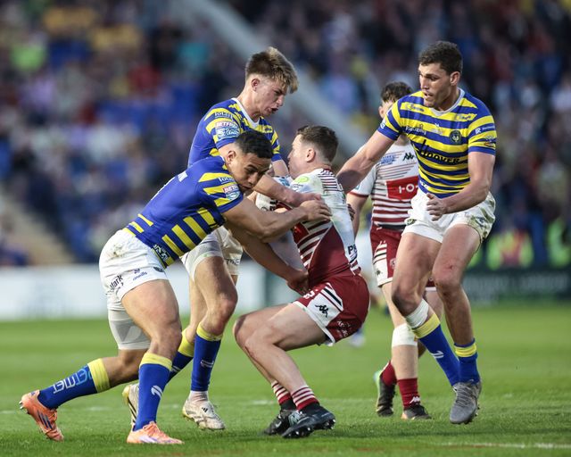 Albert Hopoate of Warrington Wolves Ewan Irwin of Warrington Wolves and Sam Stone of Warrington Wolves in action during the Betfred Super League round 9 match Warrington Wolves vs Wigan Warriors at The Halliwell Jones Stadium, Warrington, United Kingdom on 24 April 2026

(Photo by Mark Cosgrove/News Images)