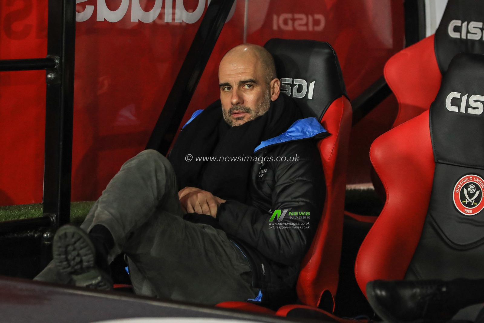 21st January 2020, Bramall Lane, Sheffield, England; Premier League, Sheffield United v Manchester City : Pep Guardiola manager of Manchester City sits in the dugout before kick-off