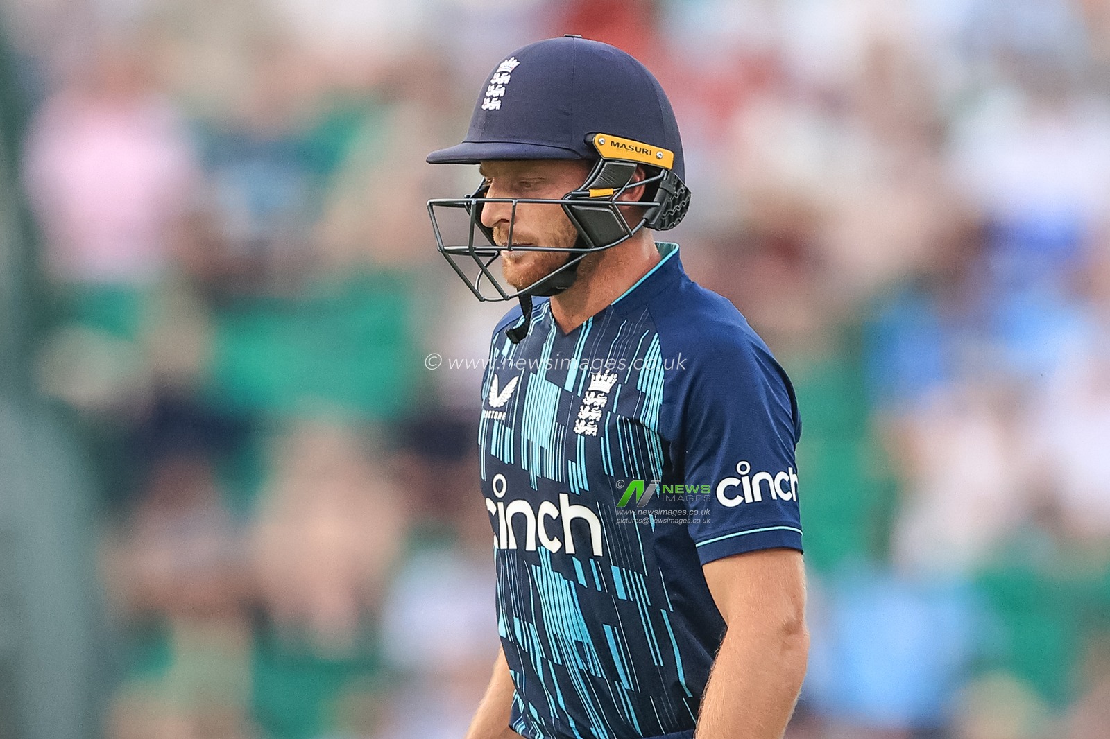 Jos Buttler of England leaves the field after being dismissed