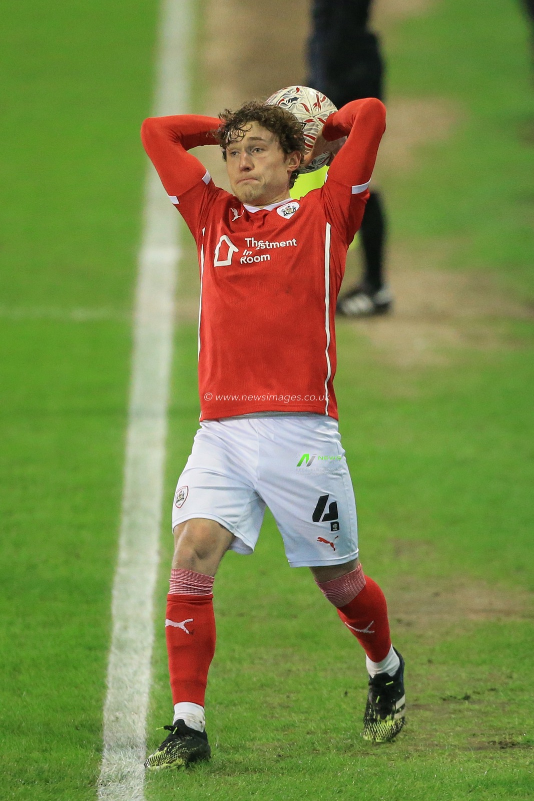 Callum Styles #4 of Barnsley takes a throw-in