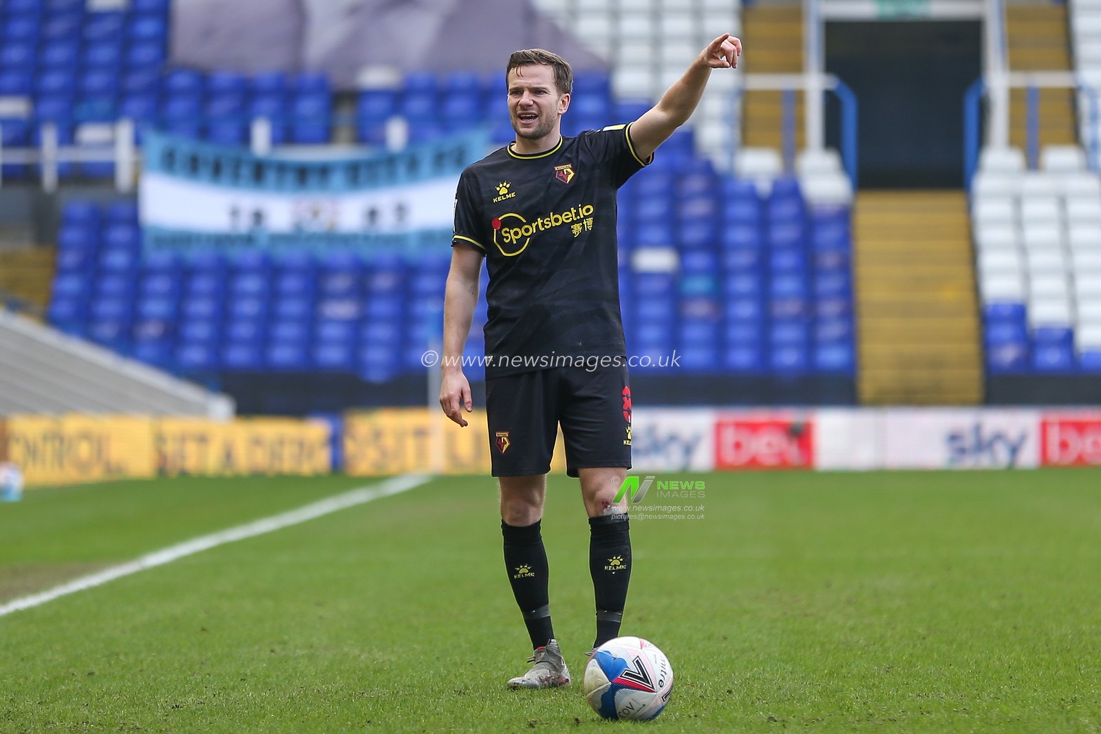 Tom Cleverley #8 of Watford prepares to take a free kick
