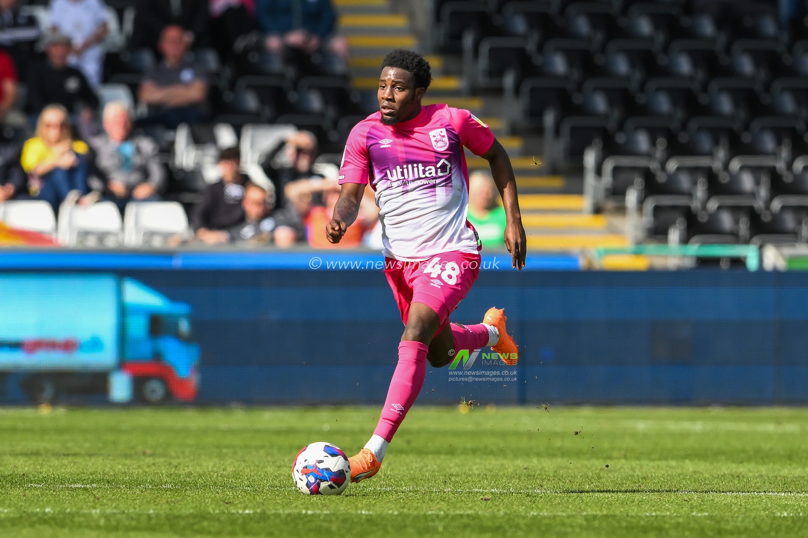 Jaheim Headley #48 of Huddersfield Town makes a break with the ball  during the Sky Bet Championship match Swansea City vs Huddersfield Town at Swansea.com Stadium, Swansea, United Kingdom, 15th April 2023

(Photo by Craig Thomas/News Images)