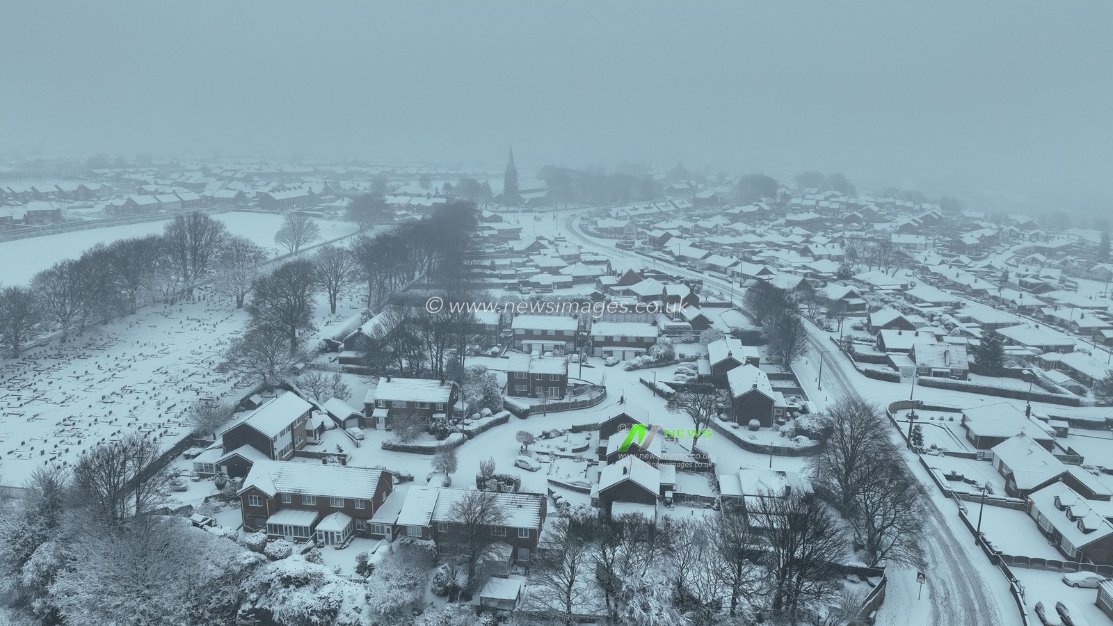 Main roads remains covered in heavy snow as heavy Snow falls in the village of Monk Bretton after a amber weather warning was issues overnight, Monk Bretton, Barnsley, United Kingdom, 5th January 2025

(Photo by Mark Cosgrove/News Images)