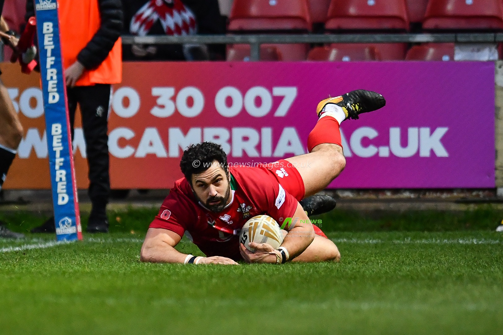 11th November 2018 , Racecourse Ground,  Wrexham, Wales ;  Rugby League World Cup Qualifier,Wales v Ireland ; Rhys Williams of Wales crosses for a try 


Credit:   Craig Thomas/News Images