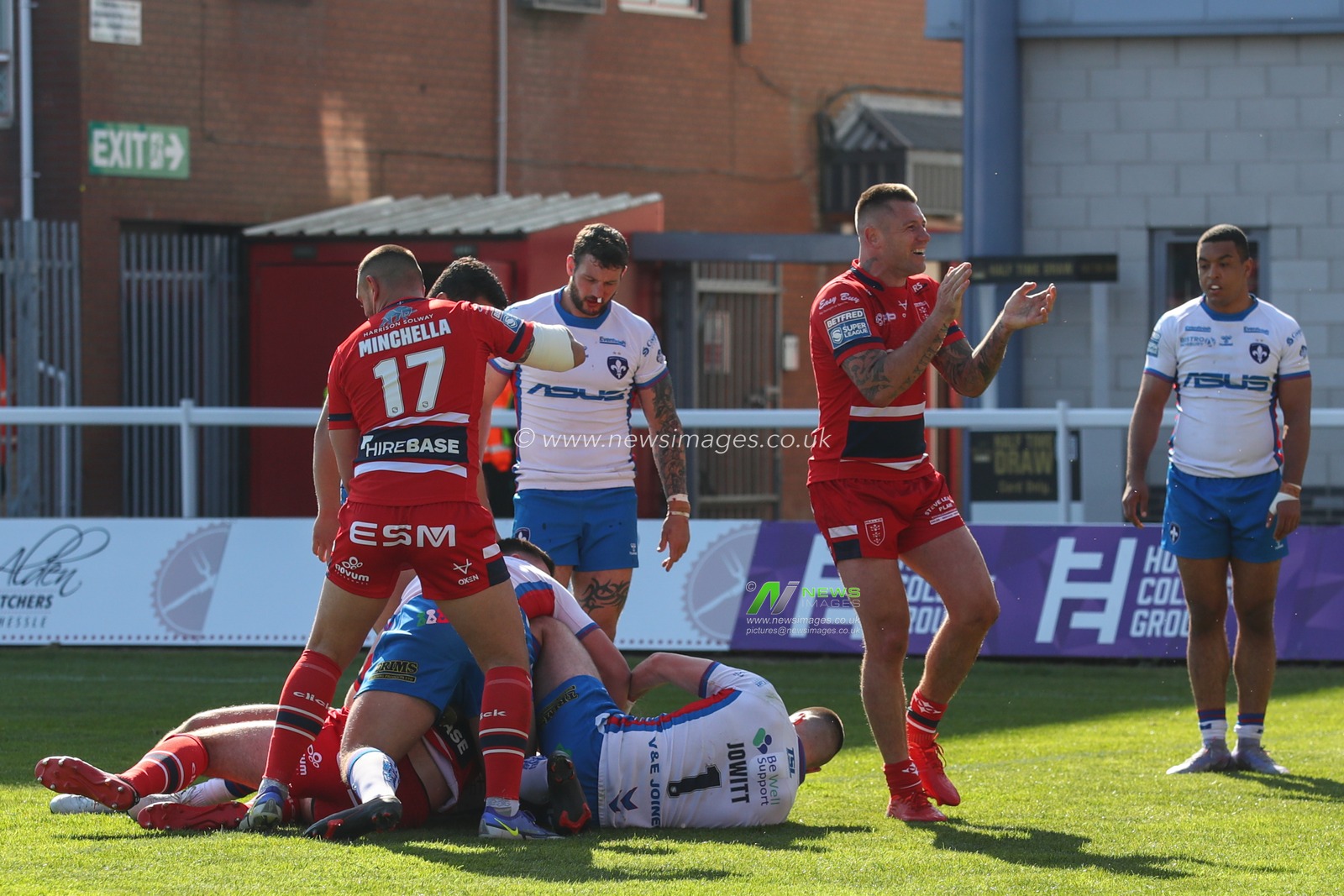 Shaun Kenny-Dowall #4 of Hull KR celebrates Kane Linnett #12 of Hull KR scoring his second try of the match