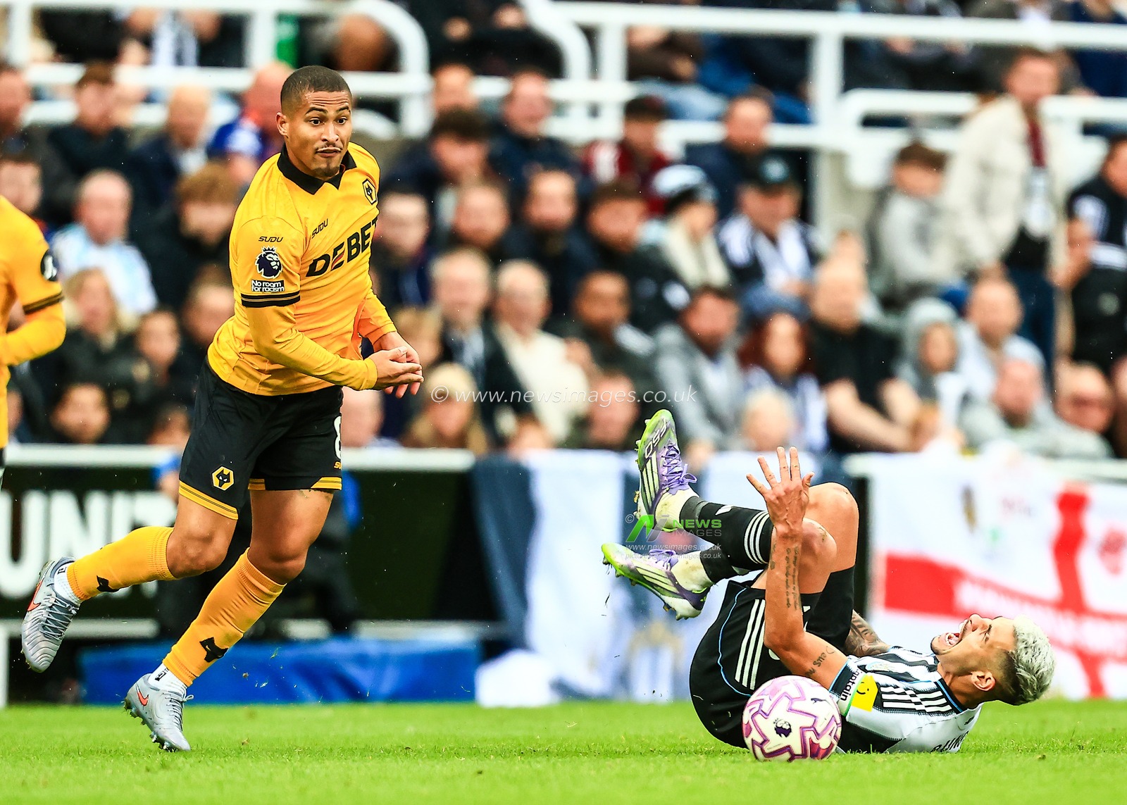 Bruno Guimaraes of Newcastle United is fouled by João Gomes of Wolverhampton Wanderers during the Premier League match Newcastle United vs Wolverhampton Wanderers at St. James's Park, Newcastle, United Kingdom, 13th September 2025

(Photo by Richard Bierton/News Images)