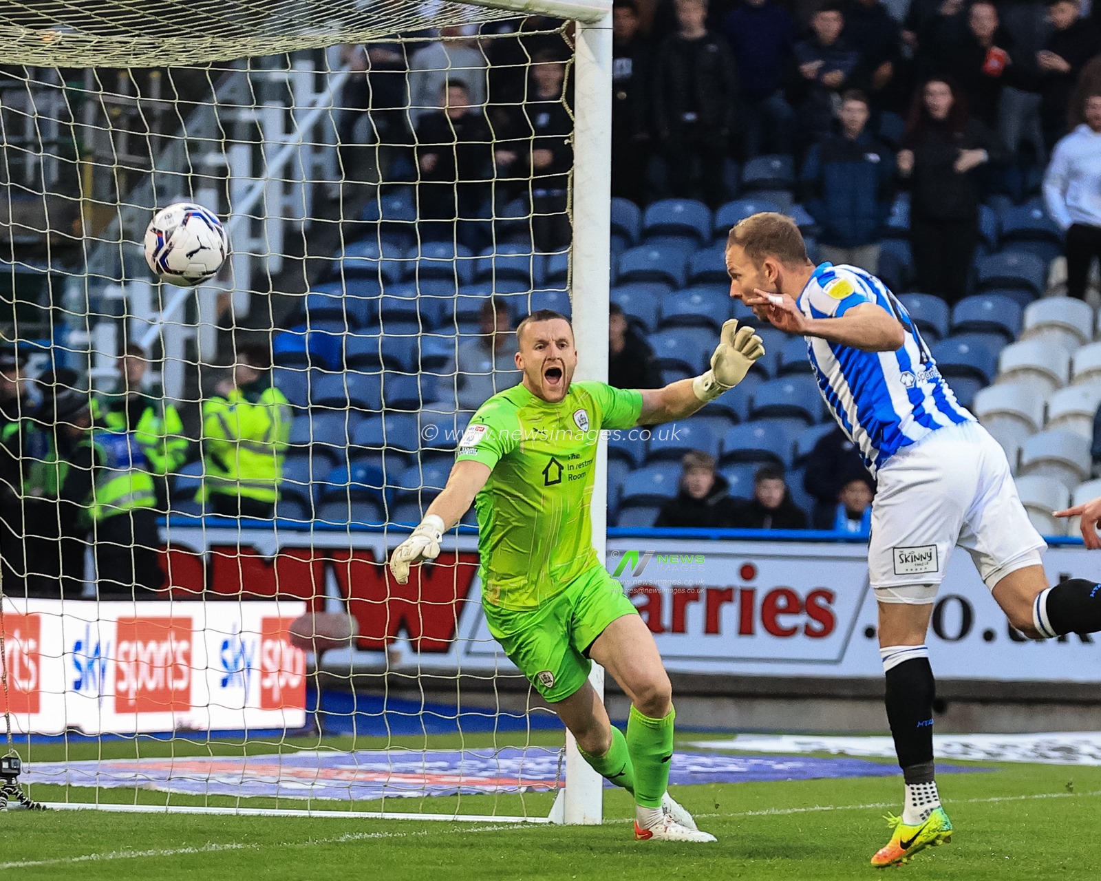 Jordan Rhodes #9 of Huddersfield Town scores to make it 1-0