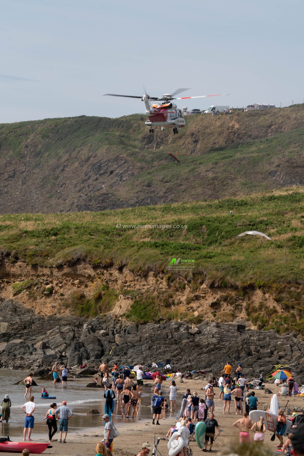 HM Coastguard helicopter is called to assist the local lifeguards and the RNLI on helping a person who had fallen on cliffs near Whitesands Beach, Pembrokeshire.