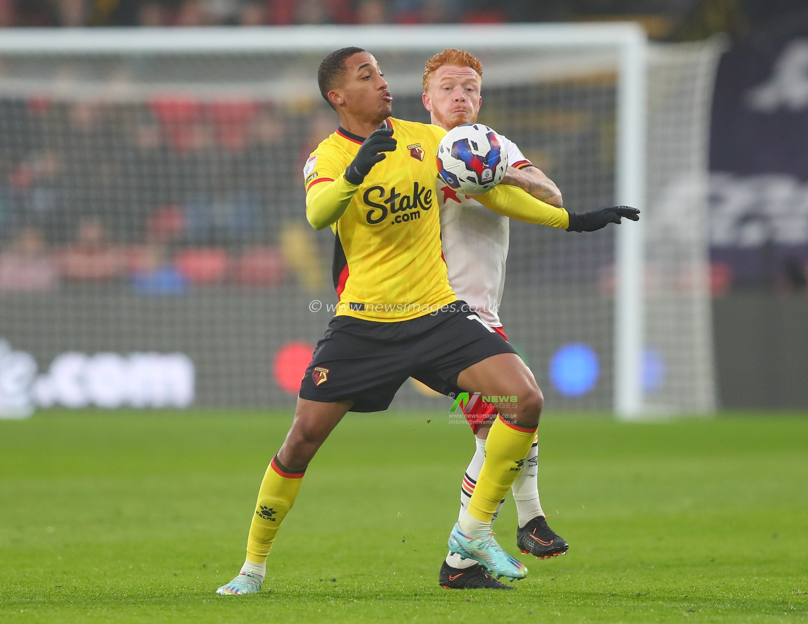 JoÃ£o Pedro #10 of Watford holds off Ryan Woods #15 of Hull City during the Sky Bet Championship match Watford vs Hull City at Vicarage Road, Watford, United Kingdom, 11th December 2022

(Photo by Gareth Evans/News Images)