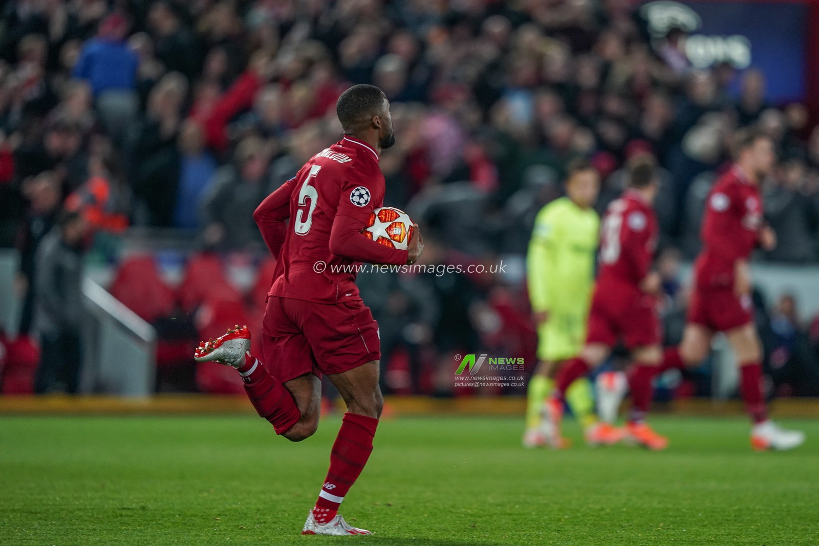 7th May 2019 , Anfield Stadium, Liverpool, England;  UEFA Champions League Semi Final, Second Leg, Liverpool FC vs FC Barcelona ; Georginio Wijnaldum (05) of Liverpool pick the ball up after scoring to make it 2-0 


Credit: Terry Donnelly/News Images