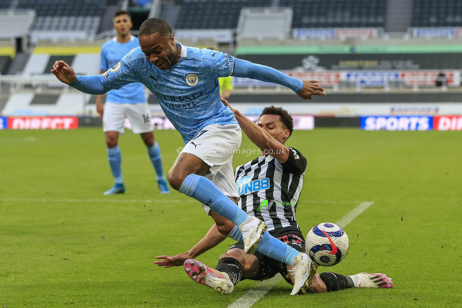 Jacob Murphy #23 of Newcastle United tackles Raheem Sterling #7 of Manchester City