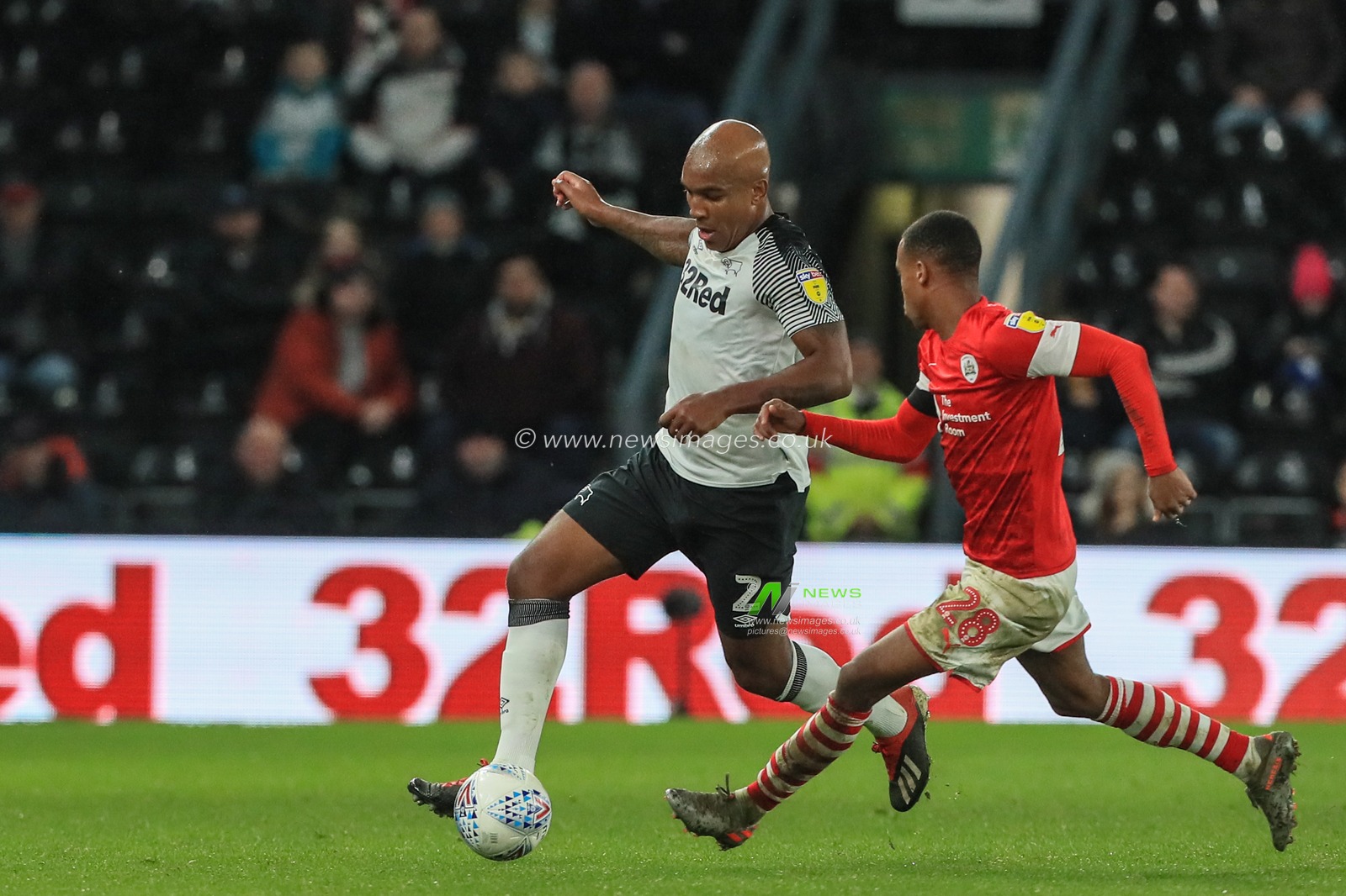 2nd January 2020, Pride Park Stadium, Derby, England; Sky Bet Championship, Derby County v Barnsley : Andre Wisdom (2) of Derby County breaks with the ball as Elliot Jorge Simoes Inacio (28) of Barnsley tracks him 

Credit: Mark Cosgrove/News Images