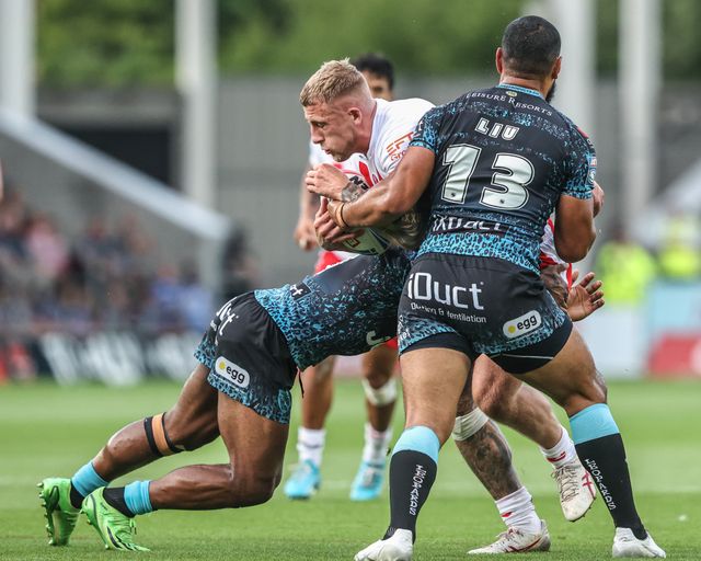 Jake Wingfield of St. Helens is tackled during the Betfred Super League round 19 match St Helens vs Leigh Leopards at Totally Wicked Stadium, St Helens, United Kingdom, 17th July 2025

(Photo by Alfie Cosgrove/News Images)