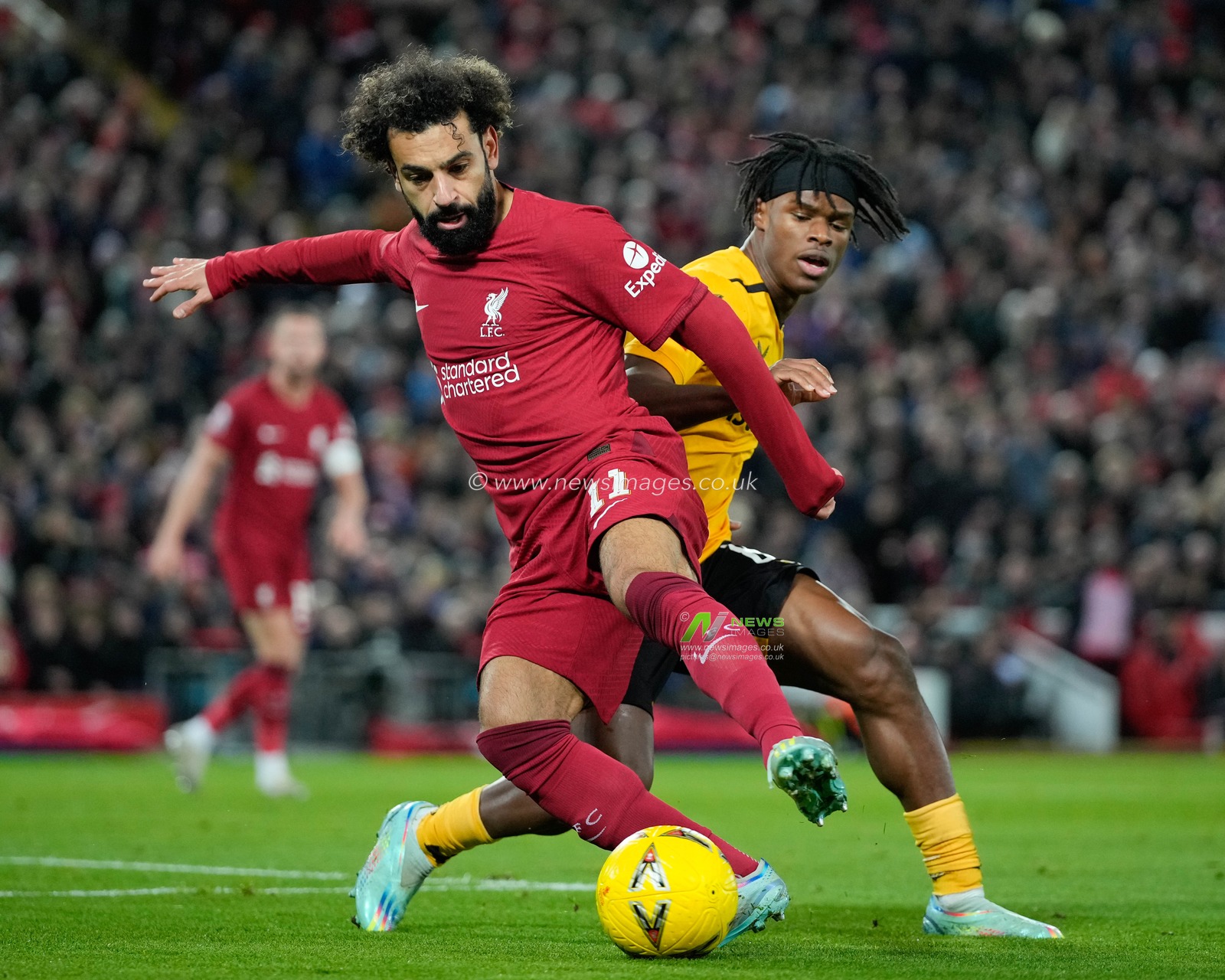Dexter Lembikisa #81 of Wolverhampton Wanderers competes for the ball with Mohamed Salah #11 of Liverpool during the Emirates FA Cup Third Round match Liverpool vs Wolverhampton Wanderers at Anfield, Liverpool, United Kingdom, 7th January 2023

(Photo by Steve Flynn/News Images)