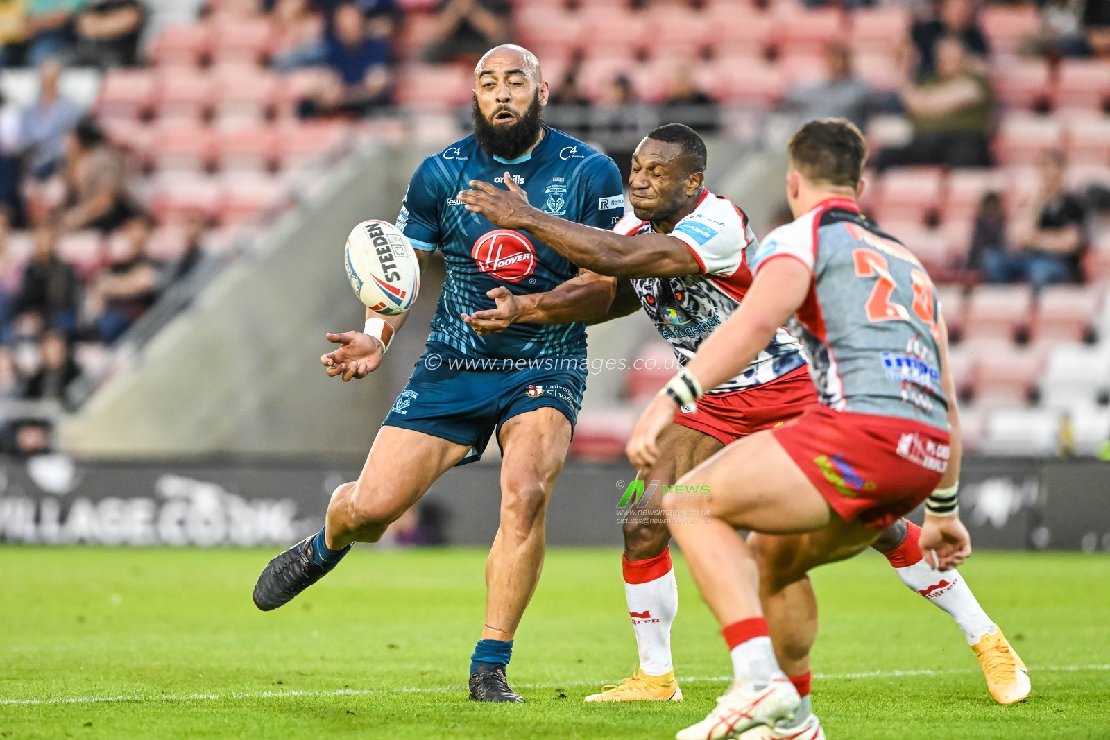 Sam Kasiano #14 of Warrington Wolves is tackled by Edwin Ipape #9 of Leigh Leopards during the Betfred Super League Round 13 match Leigh Leopards vs Warrington Wolves at Leigh Sports Village, Leigh, United Kingdom, 26th May 2023

(Photo by Craig Thomas/News Images)