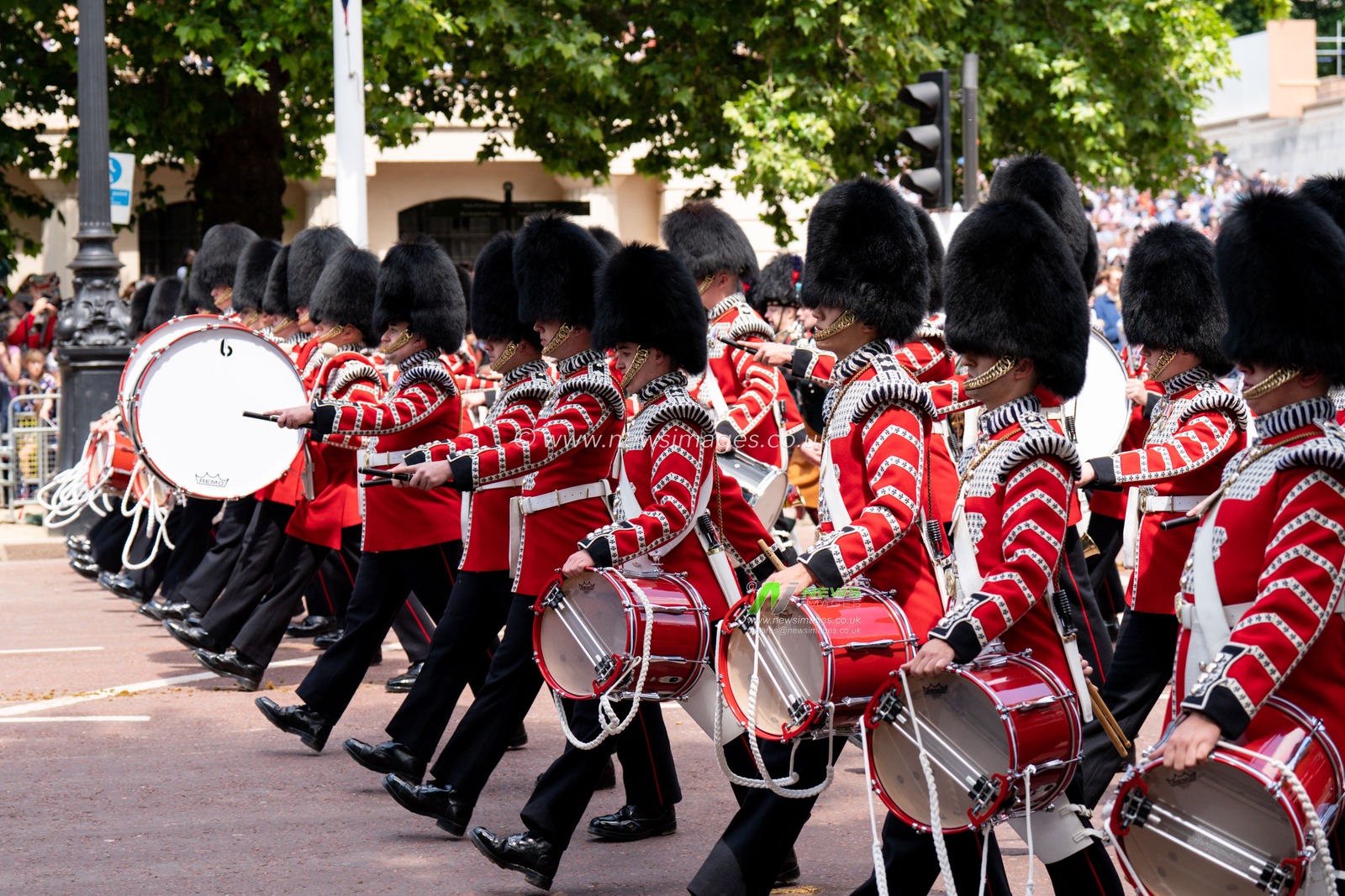 Solders take part in the parade down the mall before and after Trooping the Colour at Horse Guards Parade