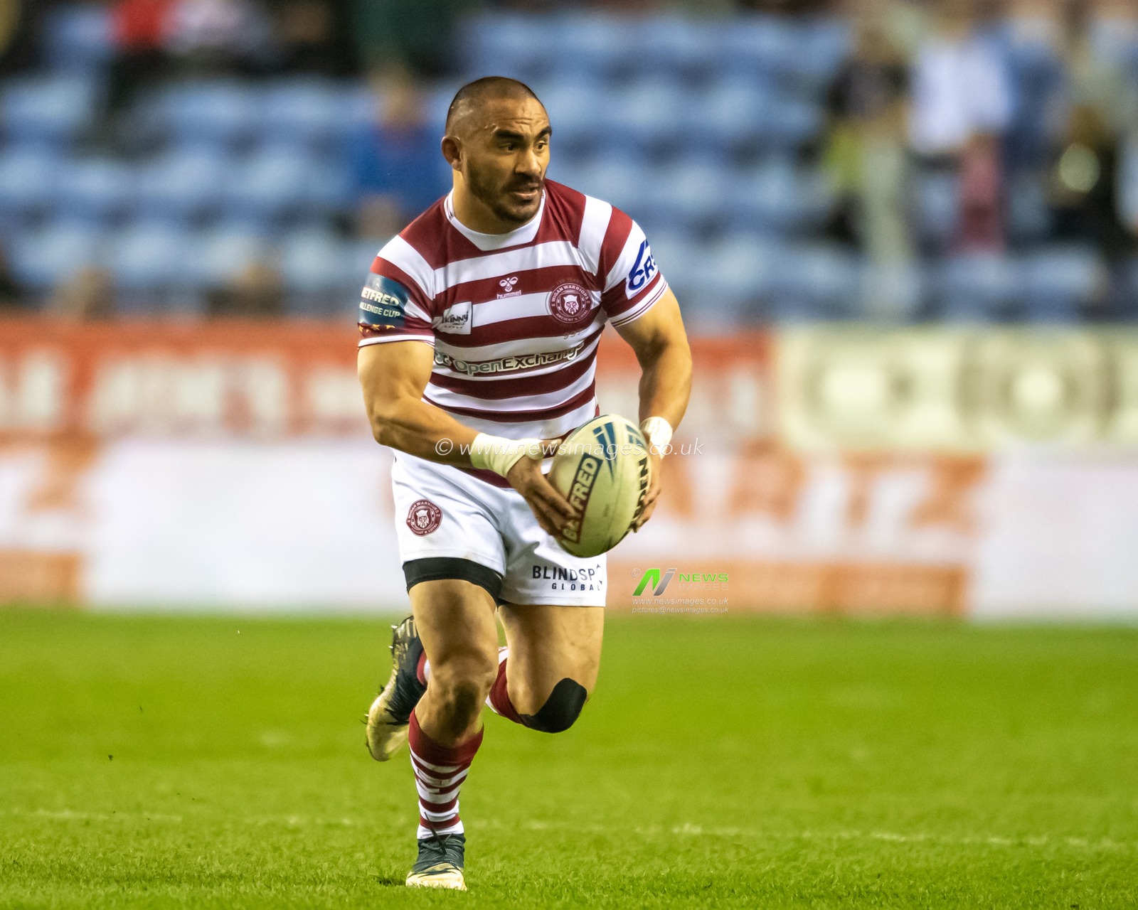 Thomas Leuluai #7 of Wigan Warriors runs forward with the ball