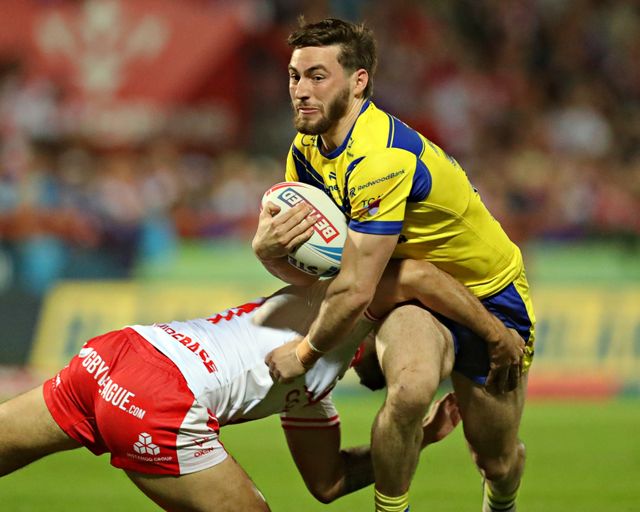 Tyrone May of Hull KR tackles Adam Holroyd of Warrington Wolves during the Betfred Super League round 27 match Hull KR vs Warrington Wolves at Sewell Group Craven Park, Kingston upon Hull, United Kingdom, 18th September 2025(Photo by Sam Eaden/News Images)