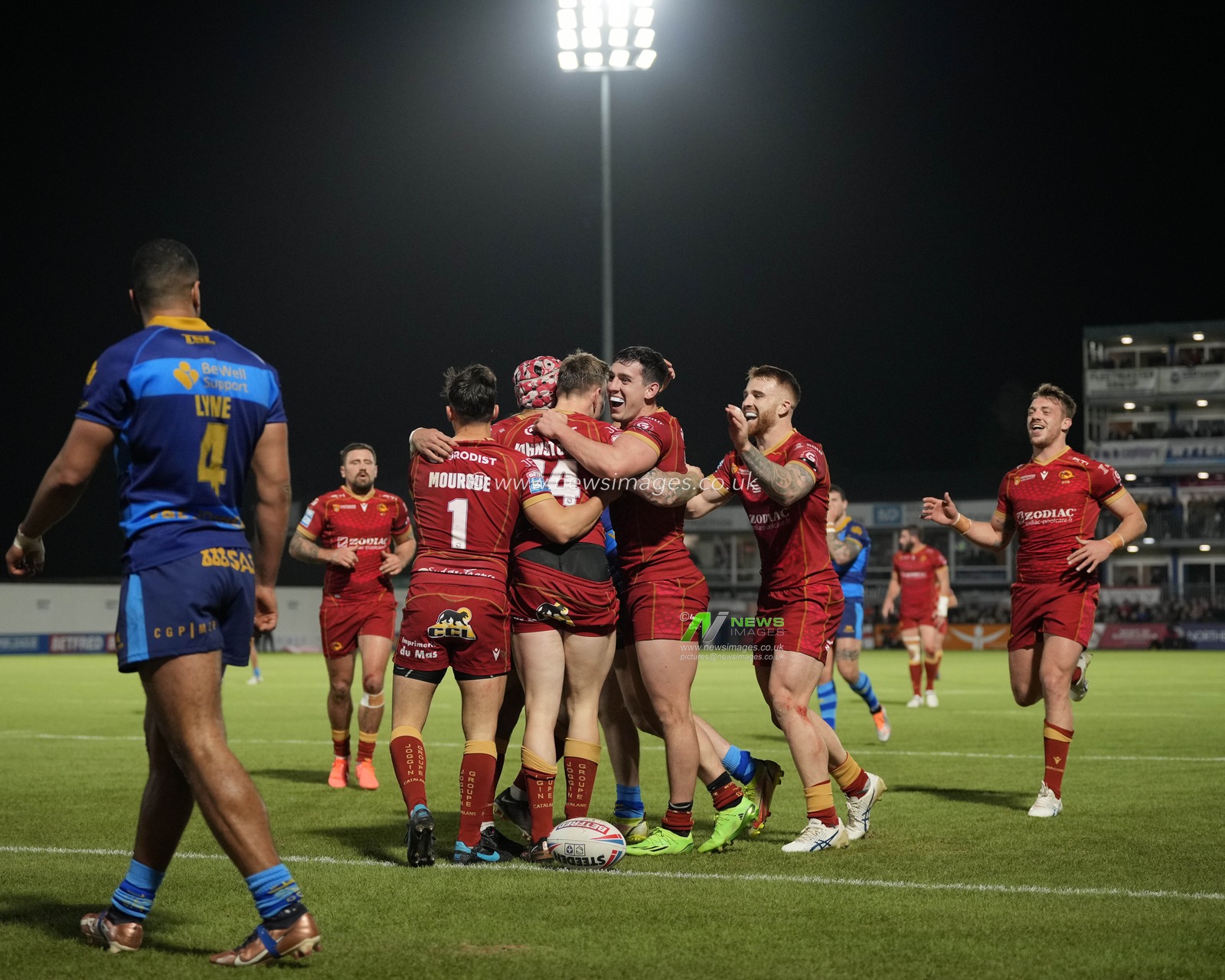 Catalans Dragons players celebrate a try with scorer Tom Johnstone #24 of Catalans Dragons during the Betfred Super League  Round 1 match Wakefield Trinity vs Catalans Dragons at The Be Well Support Stadium, Wakefield, United Kingdom, 17th February 2023

(Photo by Steve Flynn/News Images)