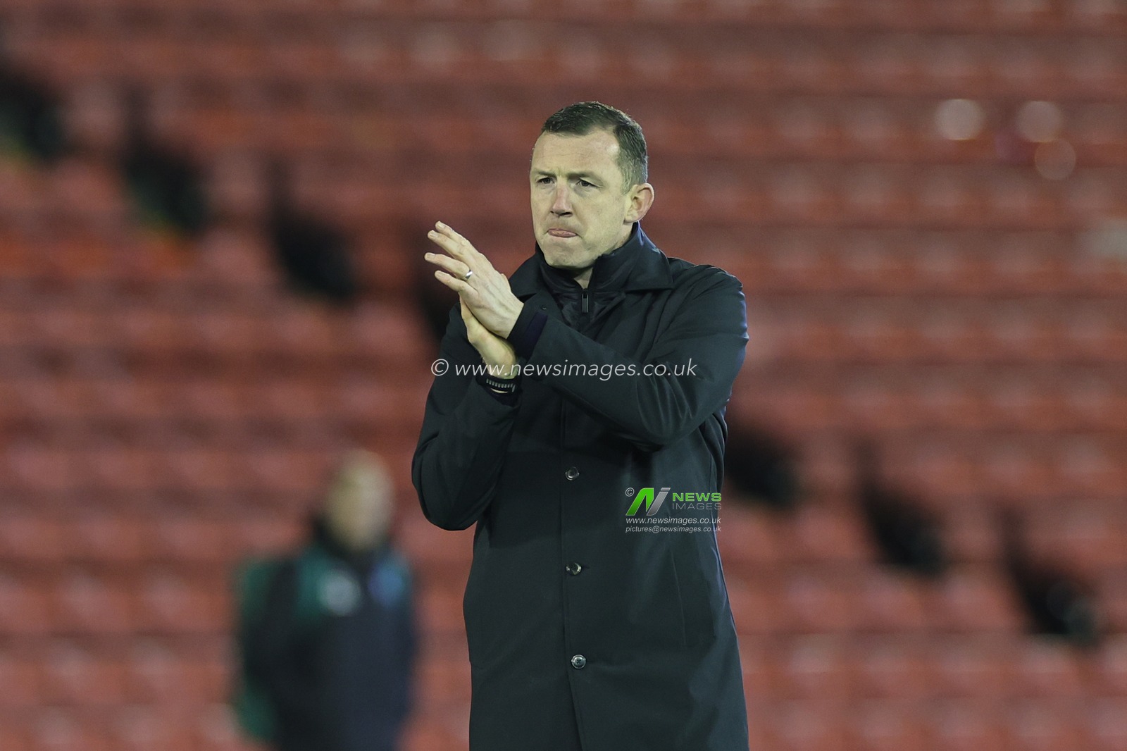 Neill Collins Head coach of Barnsley applauds the fans after the final whistle during the Sky Bet League 1 match Barnsley vs Wigan Athletic at Oakwell, Barnsley, United Kingdom, 1st January 2024

(Photo by Mark Cosgrove/News Images)