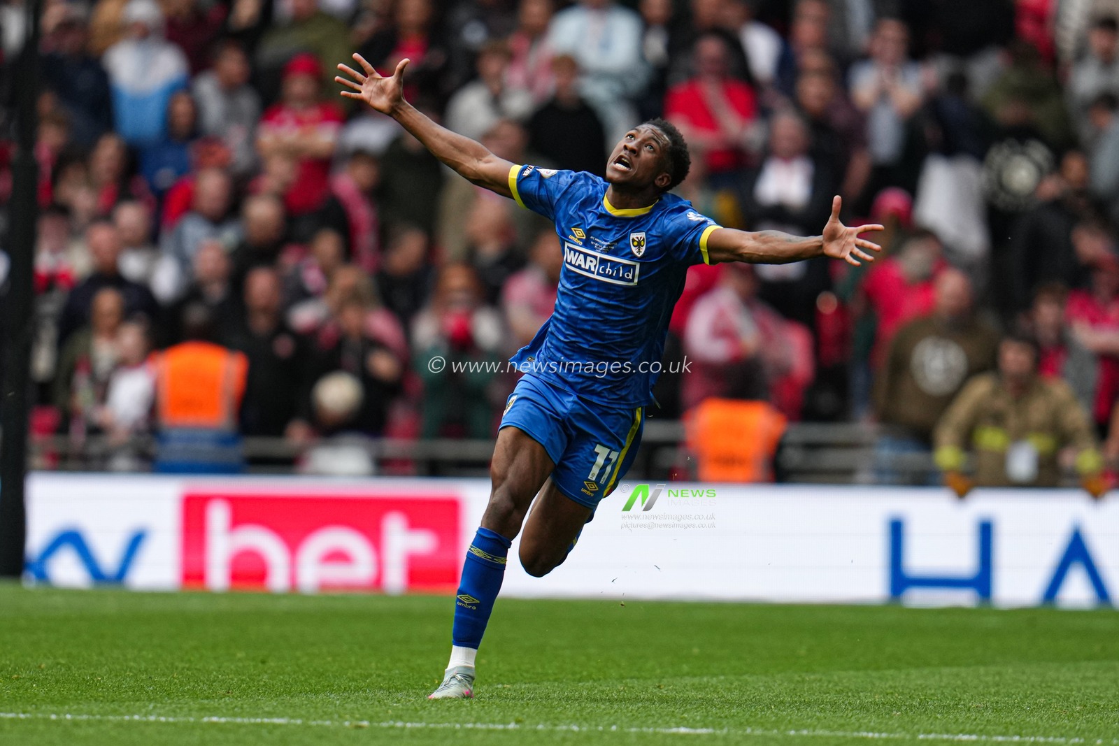 Josh Neufville of AFC Wimbledon celebrates at full time after play off win during the Sky Bet League 2 Playoff Final match AFC Wimbledon vs Walsall at Wembley Stadium, London, United Kingdom, 26th May 2025

(Photo by Harvey Murphy/News Images)