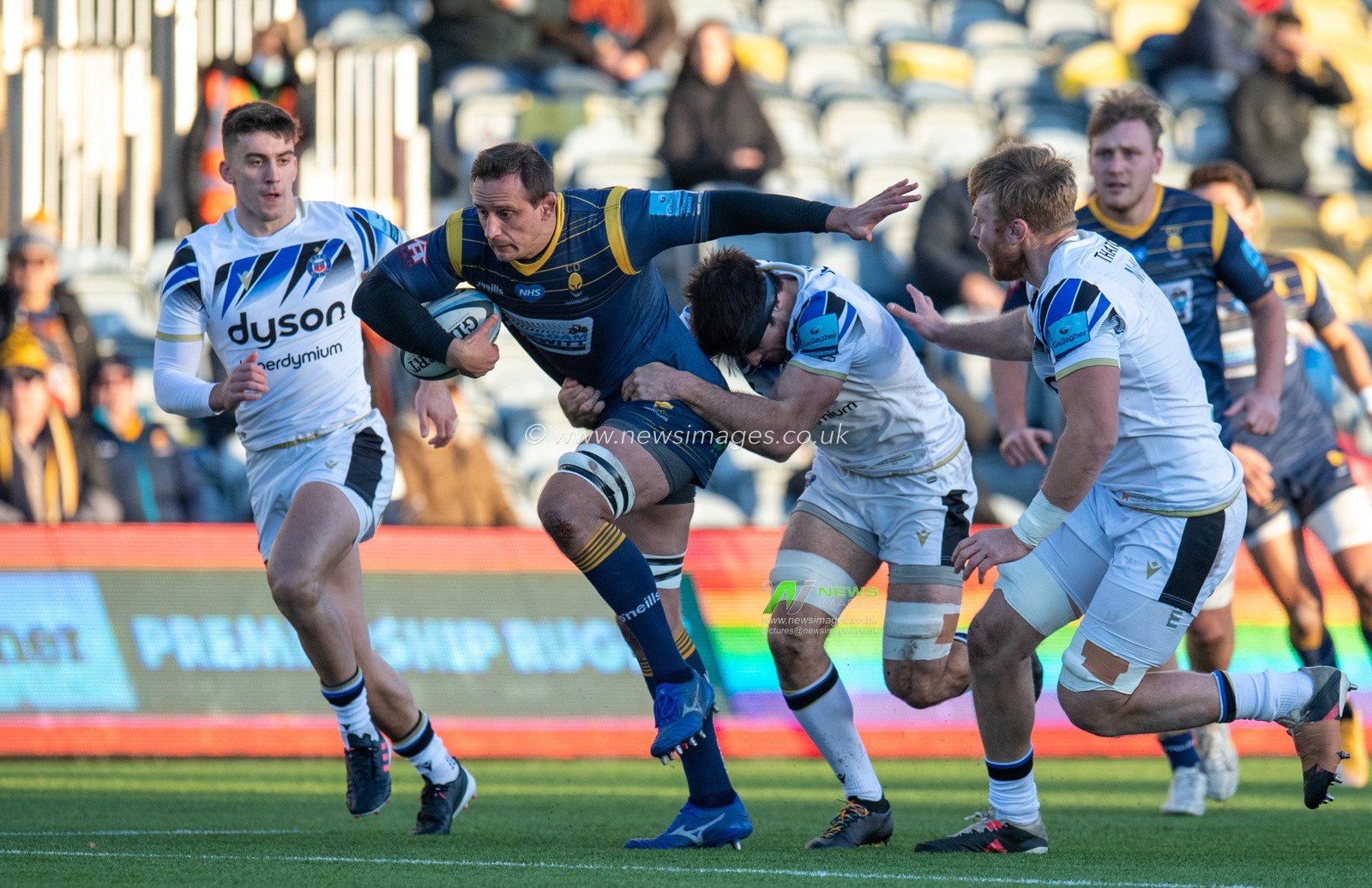 Anton Bresler (04) of Worcester Warriors drives for the tryline, but is held up short by the Bath players.
