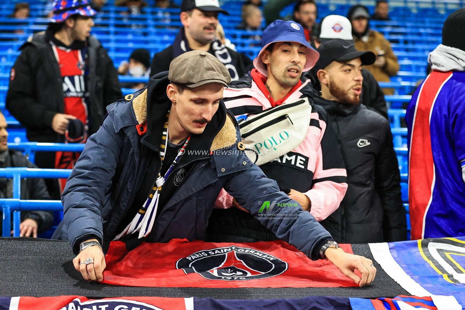 Paris Saint-Germain fans lay out there flags at the Etihad Stadium ahead of tonights game