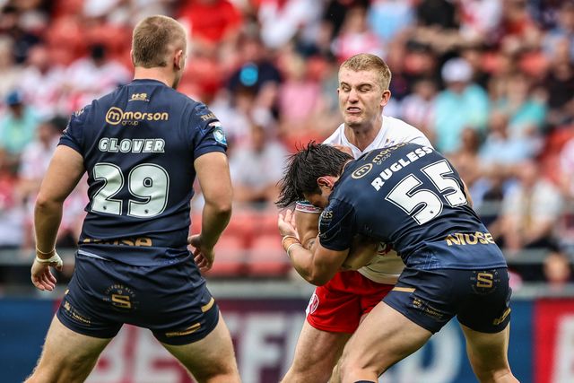 George Delaney of St. Helens is tackled during the Betfred Super League round 16 match St Helens vs Salford Red Devils at Totally Wicked Stadium, St Helens, United Kingdom, 29th June 2025

(Photo by Alfie Cosgrove/News Images)