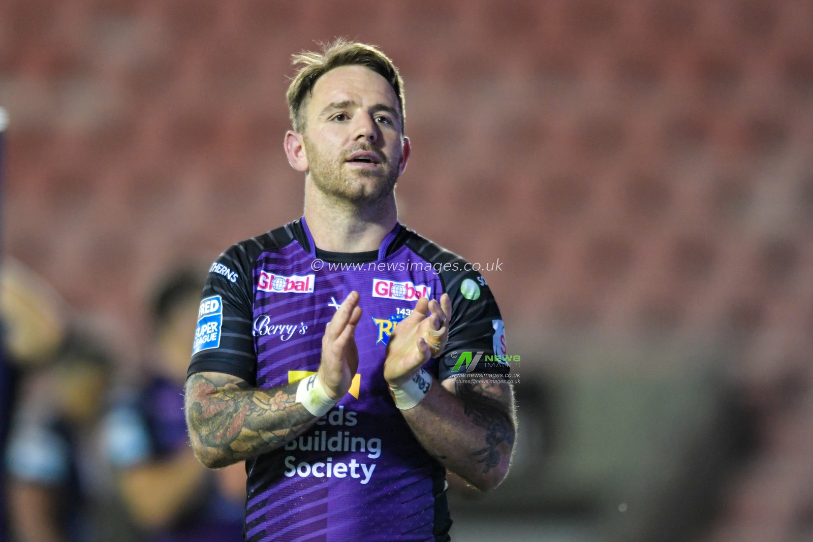 Richie Myler (16) of Leeds Rhinos applauds the travelling supporters at the end of the game