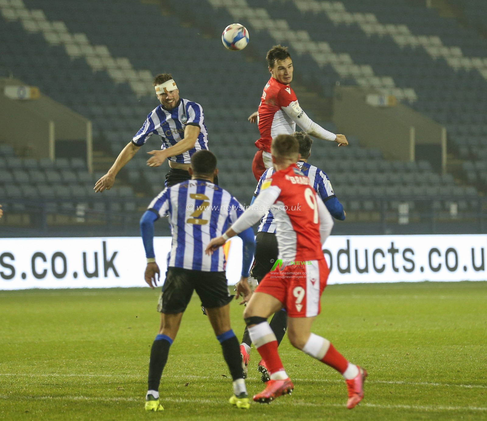 Julian Borner #13 of Sheffield Wednesday wins the high ball