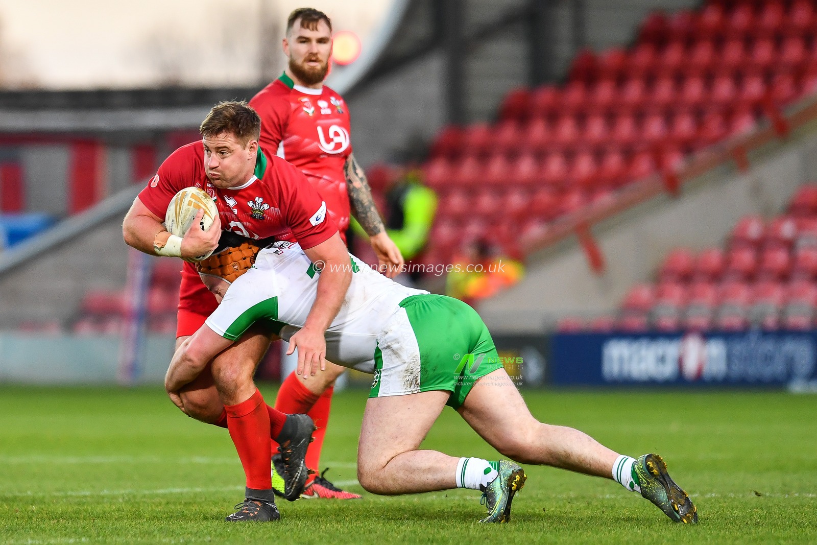 11th November 2018 , Racecourse Ground,  Wrexham, Wales ;  Rugby League World Cup Qualifier,Wales v Ireland ; Jake Emmitt of Wales is tackled by Michael Ward of Ireland 


Credit:   Craig Thomas/News Images