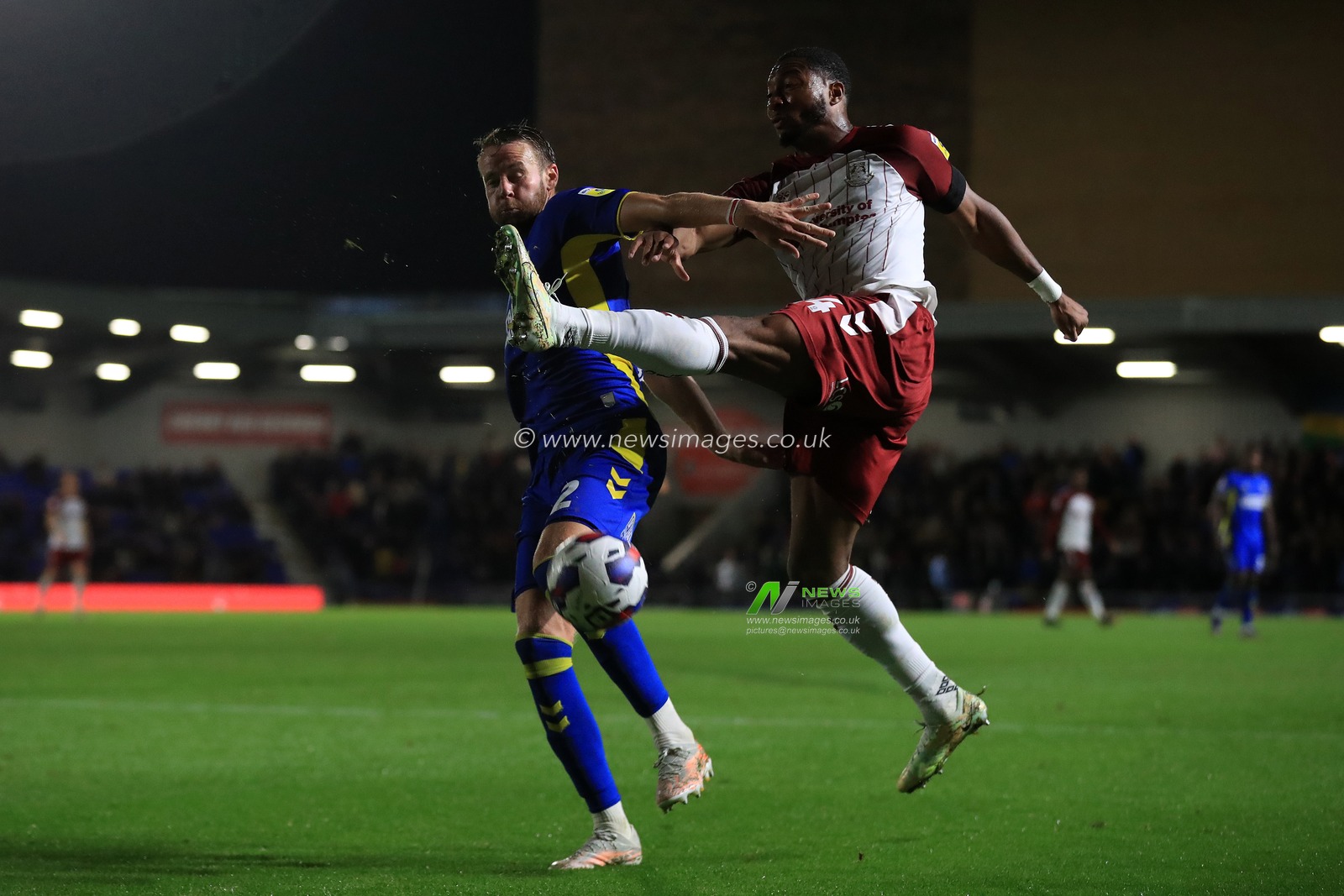 Adb-Al-Alli Morakinyo Koiki #14 of Northampton Town and Chris Gunter #2 of AFC Wimbledon during the Sky Bet League 2 match AFC Wimbledon vs Northampton Town at Cherry Red Records Stadium, Merton, United Kingdom, 13th September 2022

(Photo by Carlton Myrie/News Images)